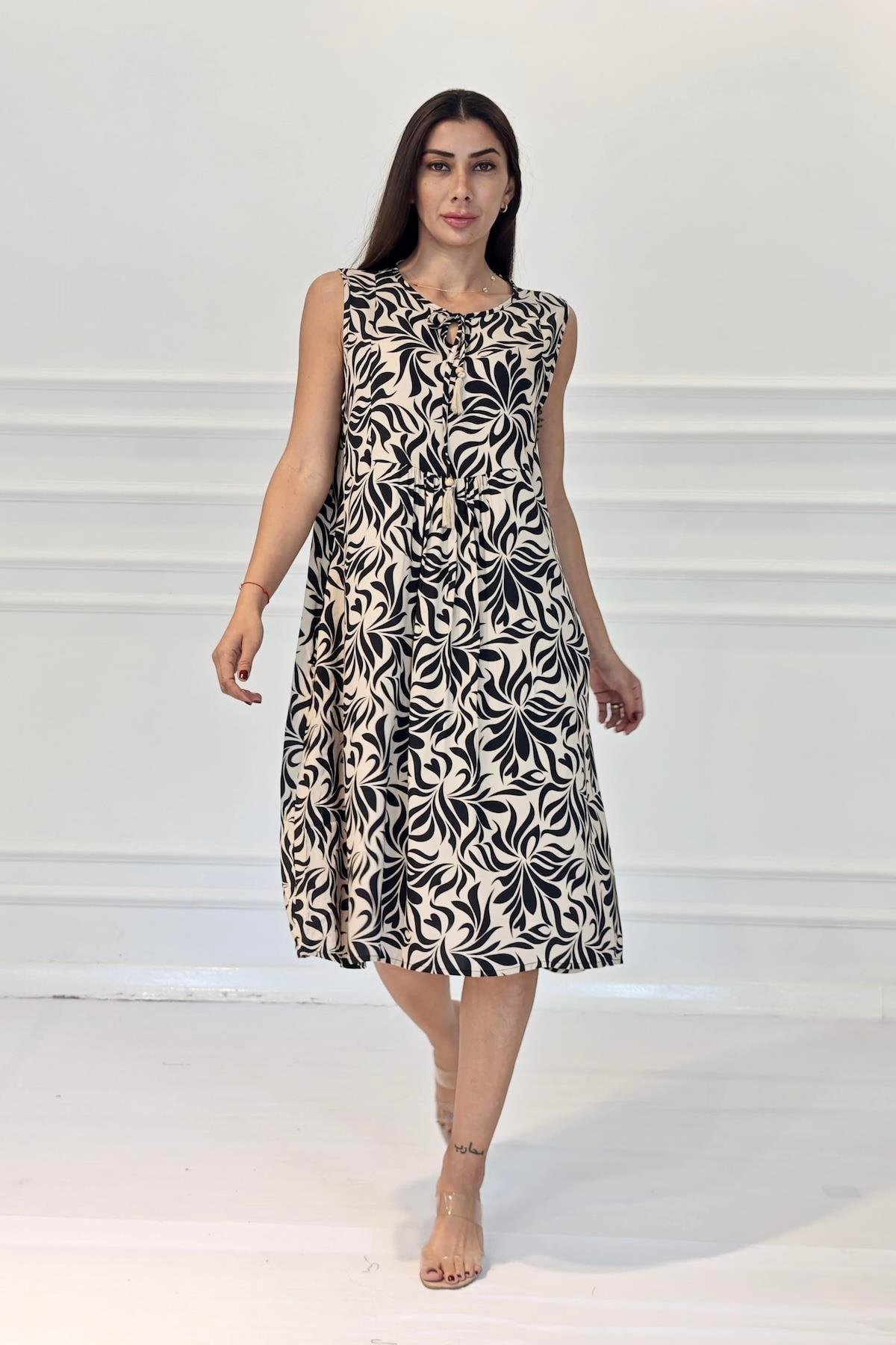 Siyah Desenli Kolsuz Boncuk Detaylı Cepli Midi Elbise