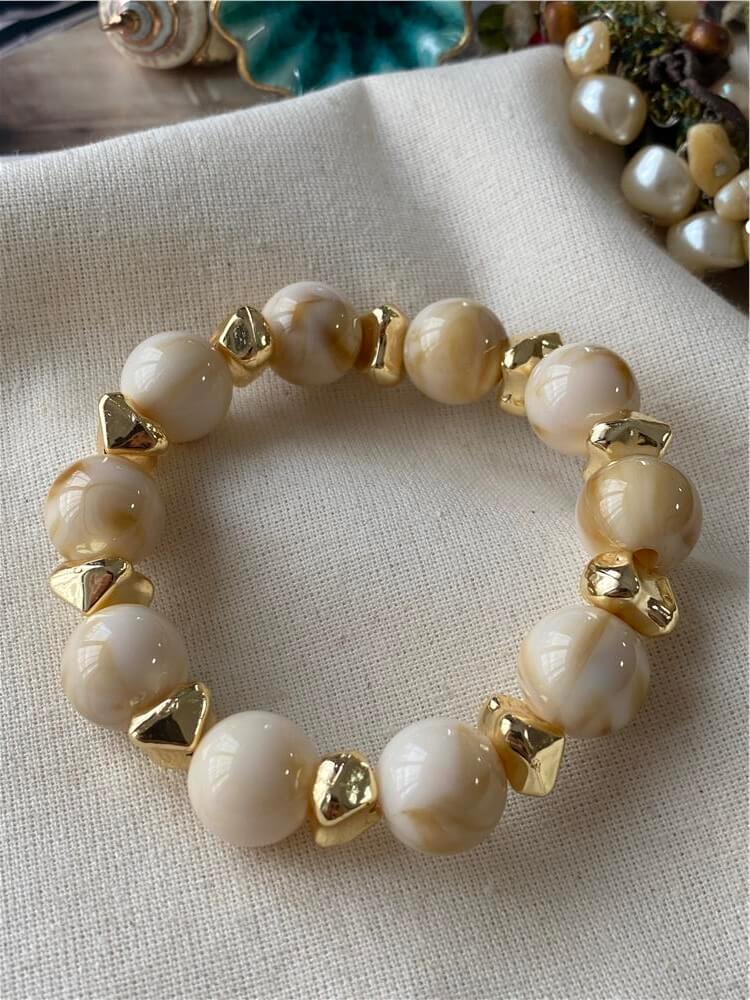 Gold Detaylı Krem Topçuk Esnek Bileklik