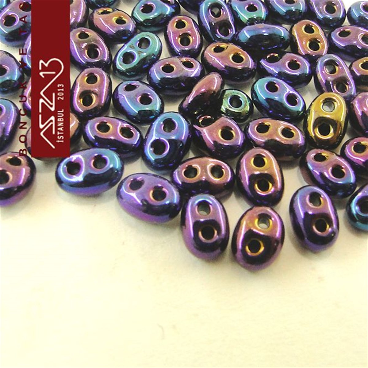 Cam Çift Delikli Twins BoncukBONCUK ve TAŞPreciosa65 Adet 2,5x5 mm Metalik Janjanlı Mavi-Mor Renkli Twin Cam Boncuk (3,8 gr)