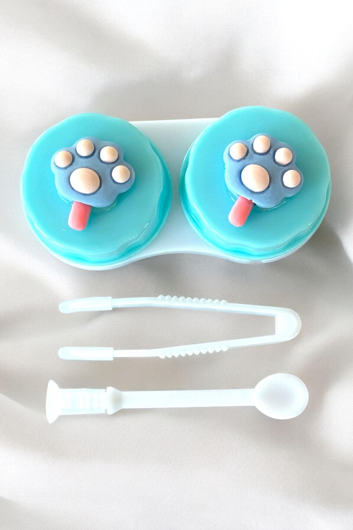 Açık Mavi Renk Yeşil Pati Figürlü Lens Saklama Kutusu