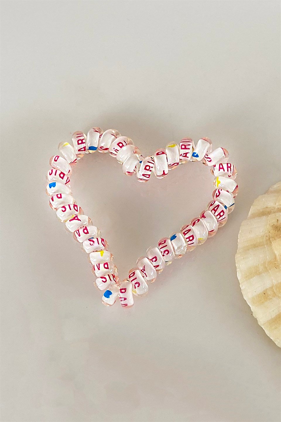 Beyaz Renk Kalpli Helezon Lastik Toka