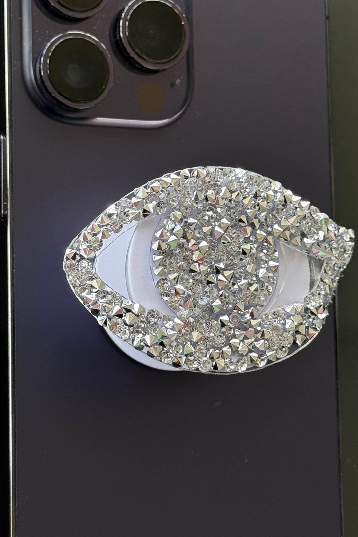 Gümüş Renk Taş Detaylı Göz Figürlü 3D Telefon Tutacağı