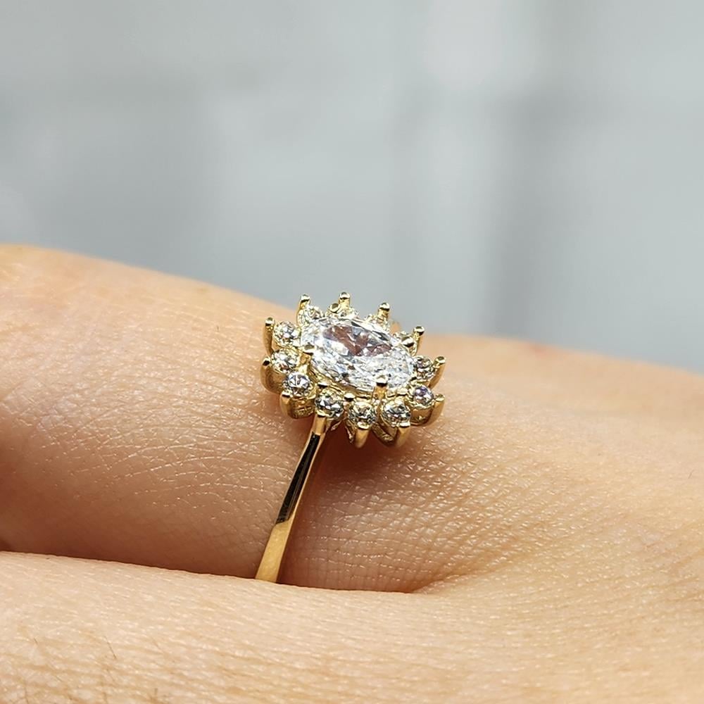 FasekgoldGÜMÜŞ YÜZÜK1,10 Karat Oval 0,24 Karat Signity Swarovski Taşlı Pırlanta Montörü Anturajlı 925 Ayar Gümüş Yüzük