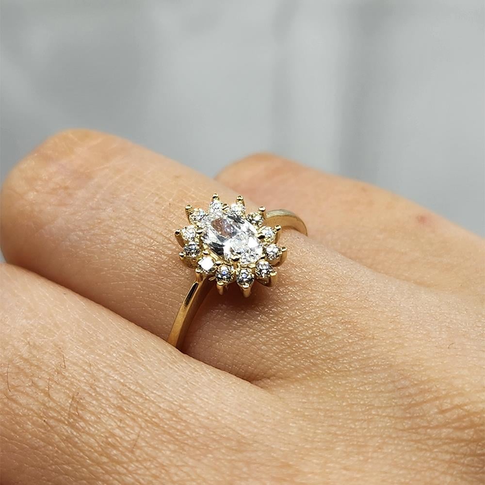 FasekgoldGÜMÜŞ YÜZÜK1,10 Karat Oval 0,24 Karat Signity Swarovski Taşlı Pırlanta Montörü Anturajlı 925 Ayar Gümüş Yüzük
