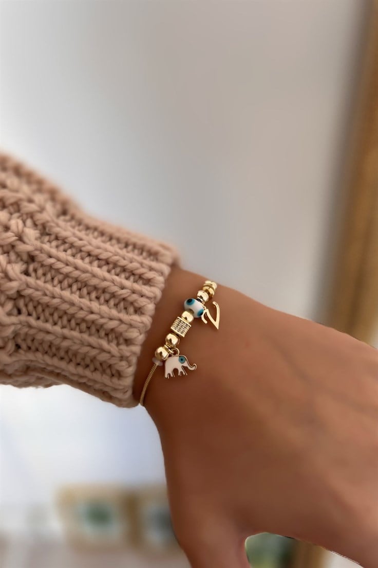 V Harfli ve Beyaz Mineli Fil Figürlü Nazar Bileklik Gold