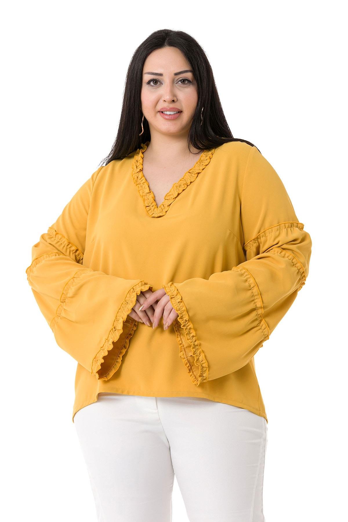 BluzDisentis Modest Büyük Beden V Yakalı Yakası ve Kolları Fırfırlı Hardal BluzDISENTIS MODESTBüyük Beden V Yakalı Kolu ve Yakası Fırfırlı Hardal Bluz