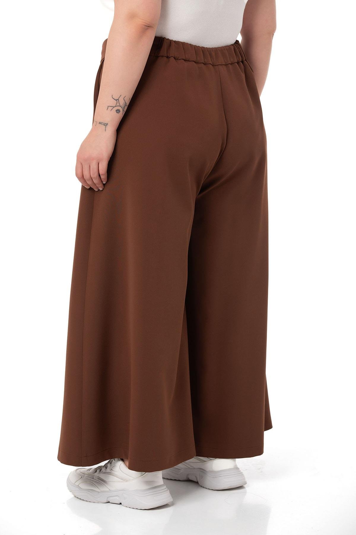 DISENTIS MODEST GENC BUYUK BEDEN GENIS PACA PANTOLONDISENTIS MODESTBüyük Beden Düğme Detaylı Geniş Paça Fermuarlı Kahverengi Pantolon