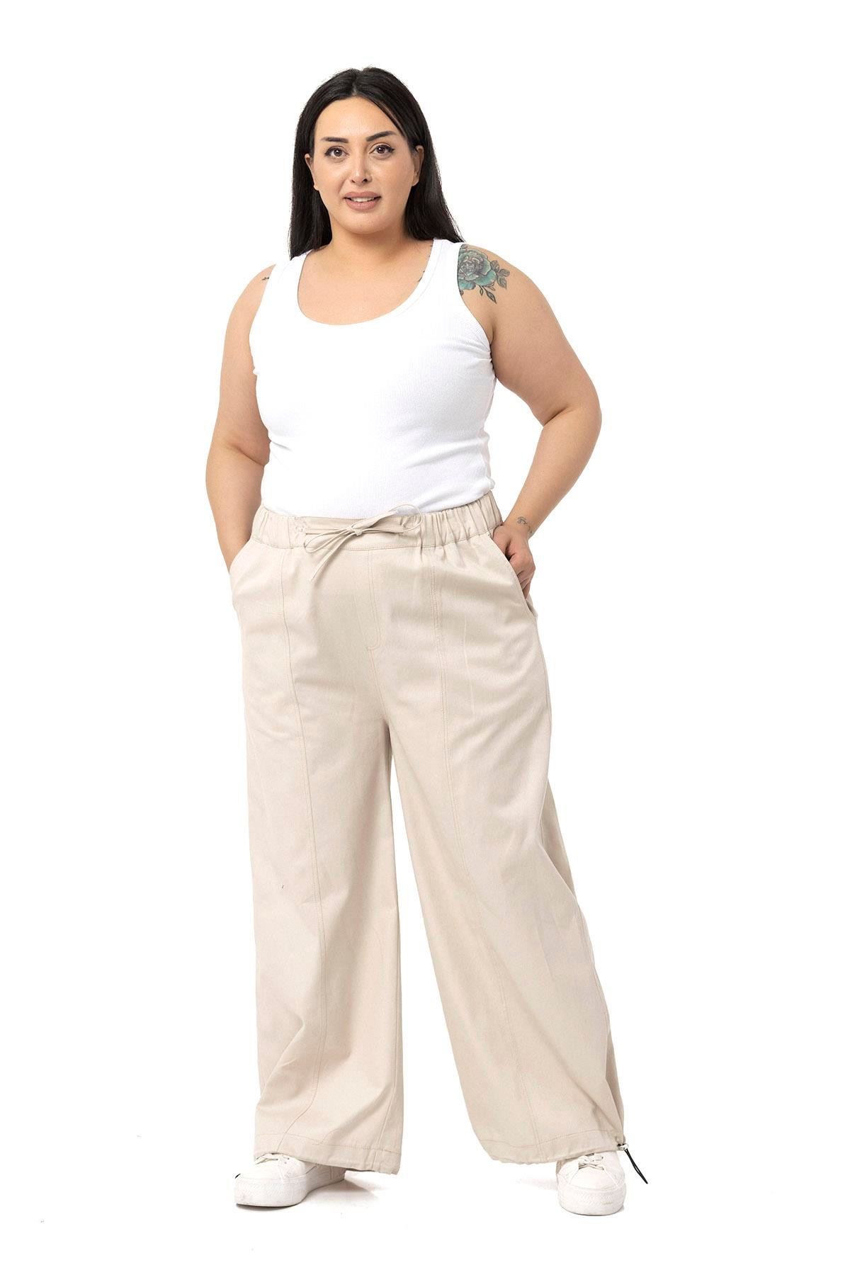 DISENTIS MODEST GENC BUYUK BEDEN GABARDIN PANTOLONDISENTIS MODESTBüyük Beden Geniş Paça Bağlama Detaylı Gabardin Bej Rengi Pantolon