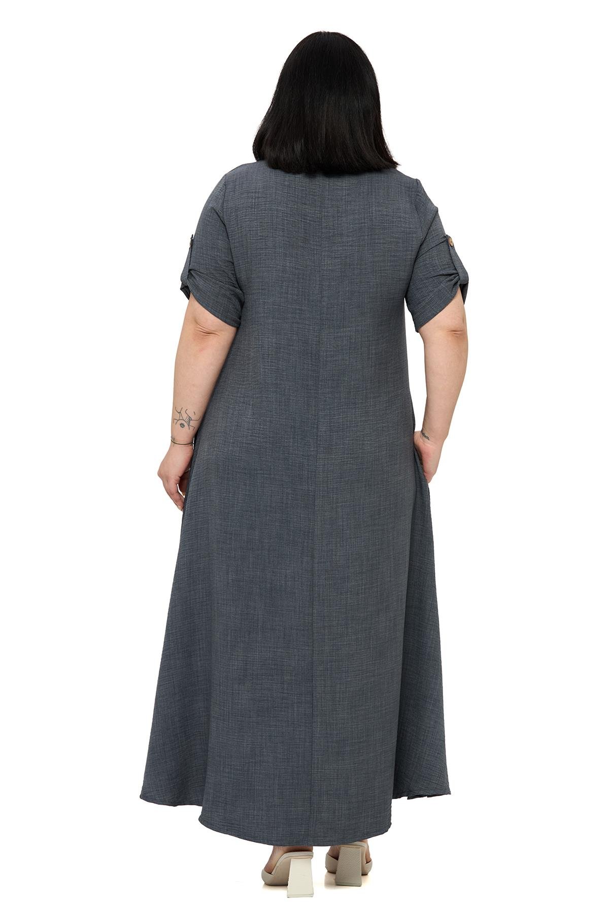 ELBİSEDisentis Modest Büyük Beden Katlamalı Yarım Kollu Apoletli Yırtmaçlı Uzun Antrasit Elbise DISENTIS MODESTBüyük Beden Katlamalı Yarım Kollu Apoletli Yırtmaçlı Uzun Antrasit Elbise 