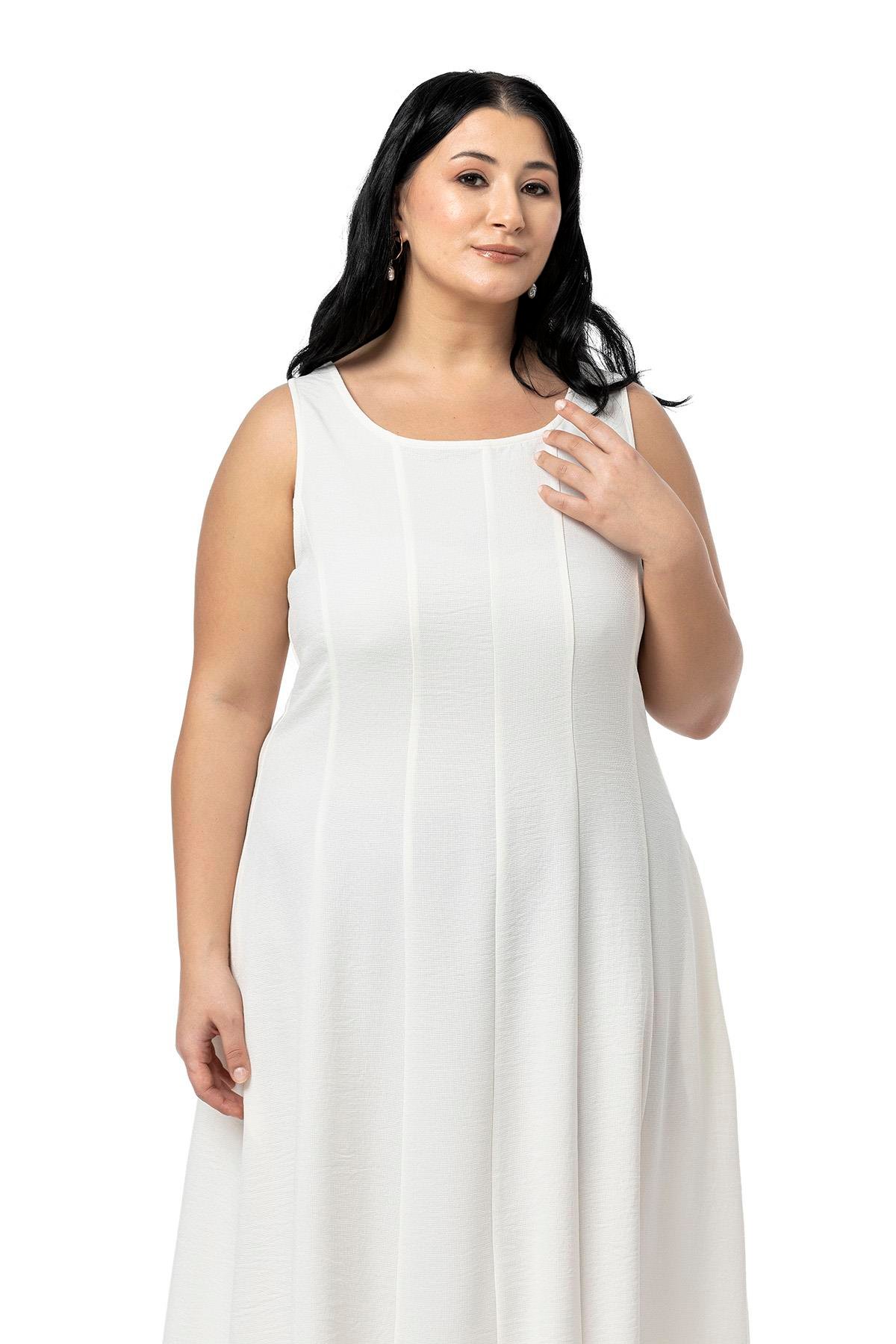 ELBİSEDisentis Modest Büyük Beden Sırtı Gipeli Yanlarda Cepli Kolsuz Uzun Beyaz Elbise  DISENTIS MODESTBüyük Beden Sırtı Gipeli Yanlarda Cepli Kolsuz Uzun Beyaz Elbise  