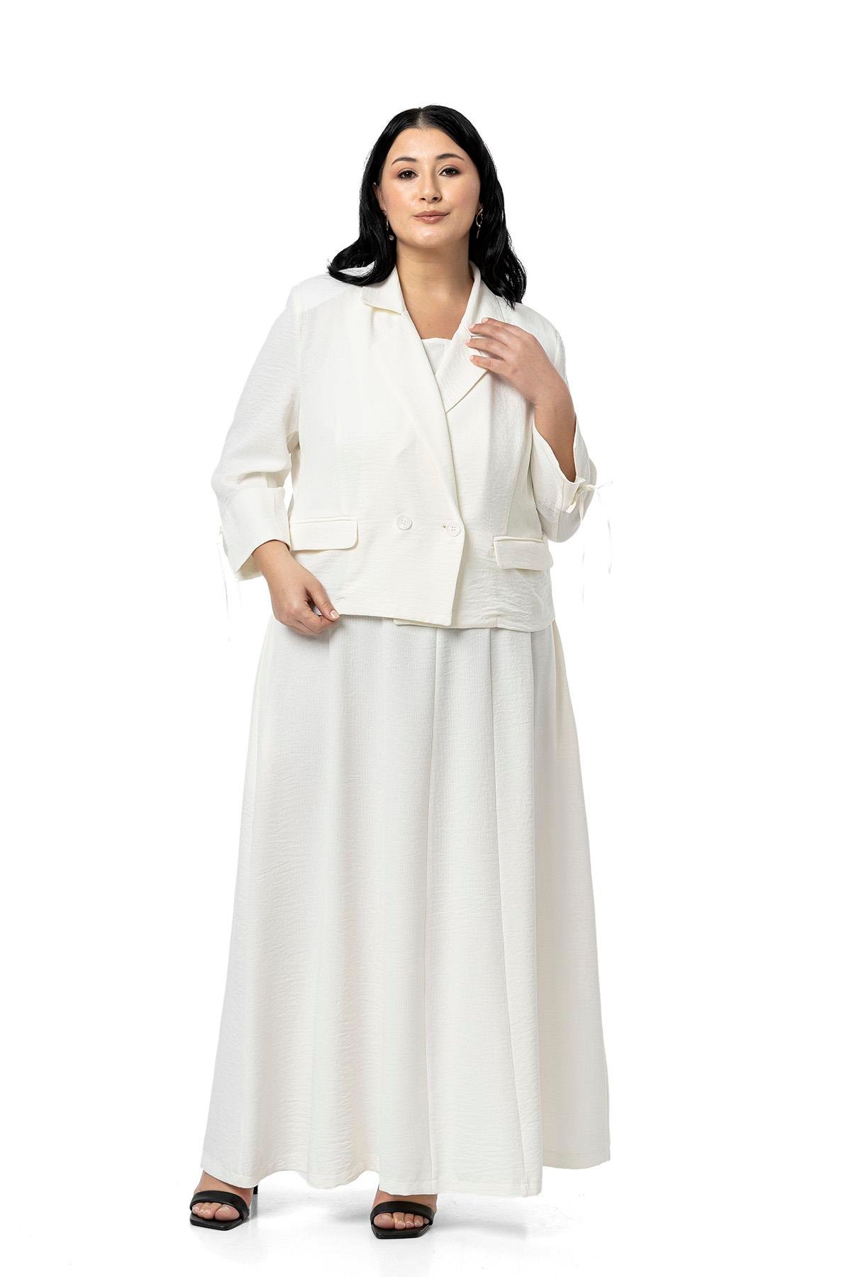 ELBİSEDisentis Modest Büyük Beden Sırtı Gipeli Yanlarda Cepli Kolsuz Uzun Beyaz Elbise  DISENTIS MODESTBüyük Beden Sırtı Gipeli Yanlarda Cepli Kolsuz Uzun Beyaz Elbise  