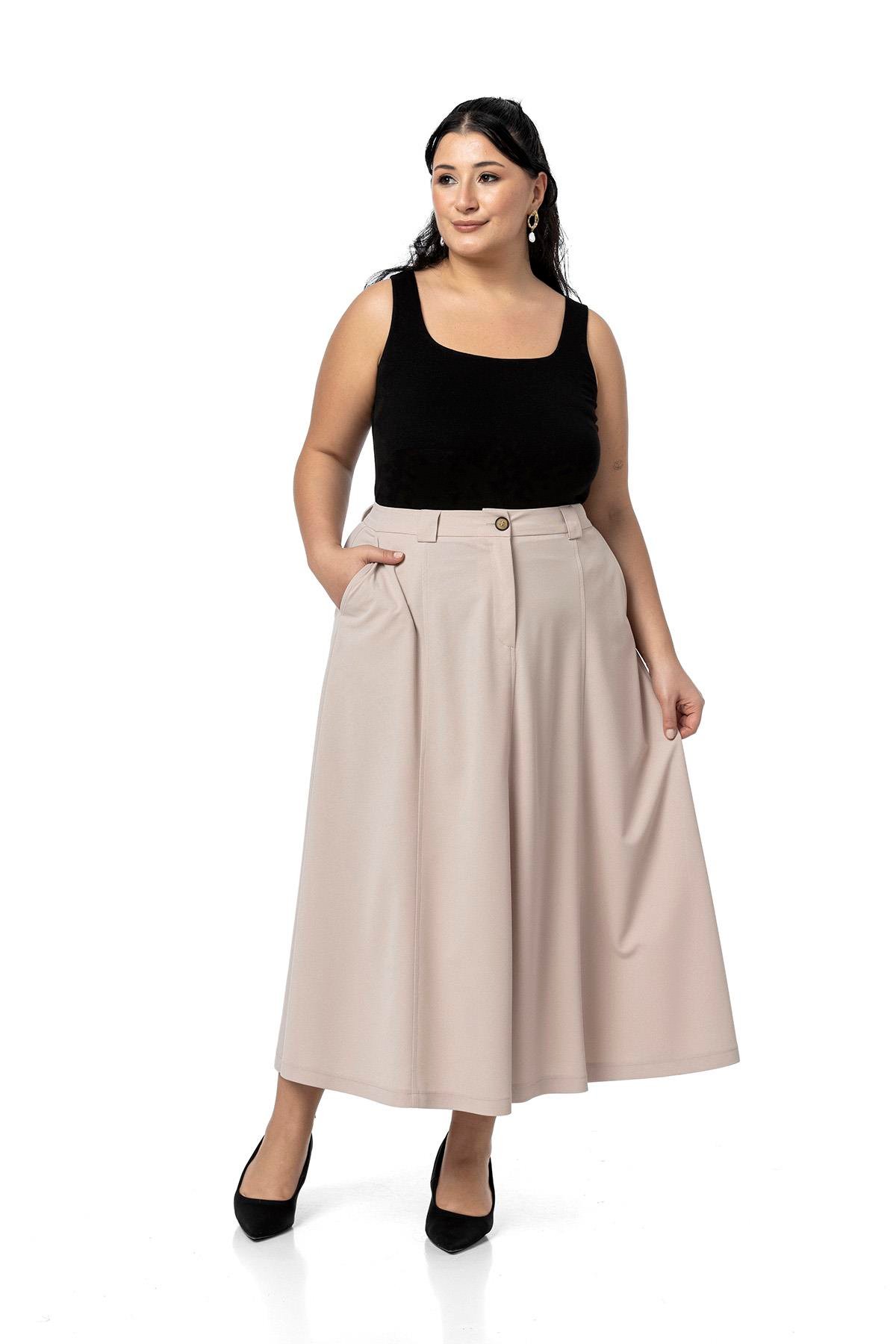 EtekDisentis Modest Büyük Beden Yanlardan Yırtmaçlı Beli Arkadan Lastikli Midi Bej Rengi EtekDISENTIS MODESTBüyük Beden Yanlardan Yırtmaçlı Beli Arkadan Lastikli Midi Bej Rengi Etek