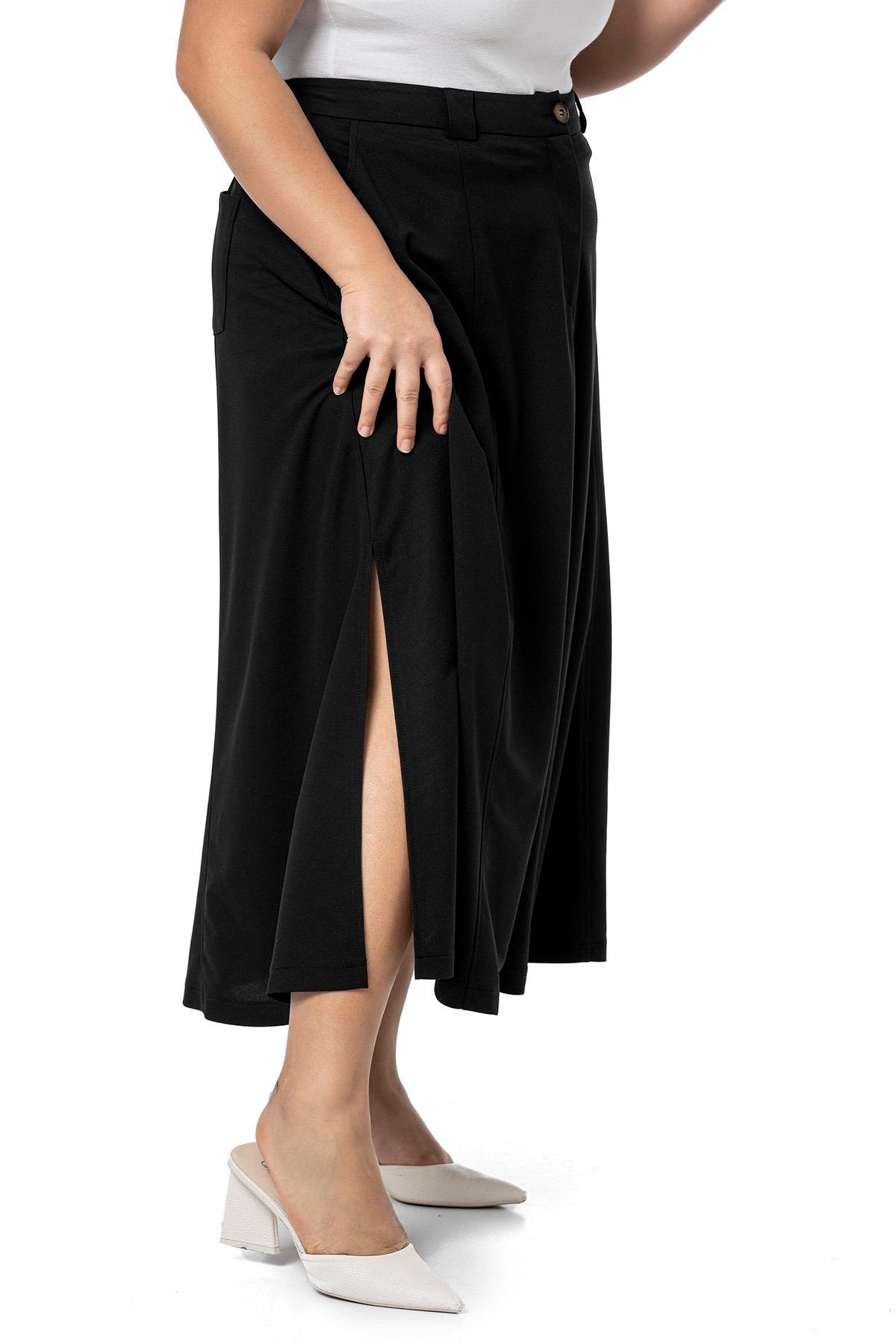 EtekDisentis Modest Büyük Beden Yanlardan Yırtmaçlı Beli Arkadan Lastikli Midi Siyah EtekDISENTIS MODESTBüyük Beden Yanlardan Yırtmaçlı Beli Arkadan Lastikli Midi Siyah Etek