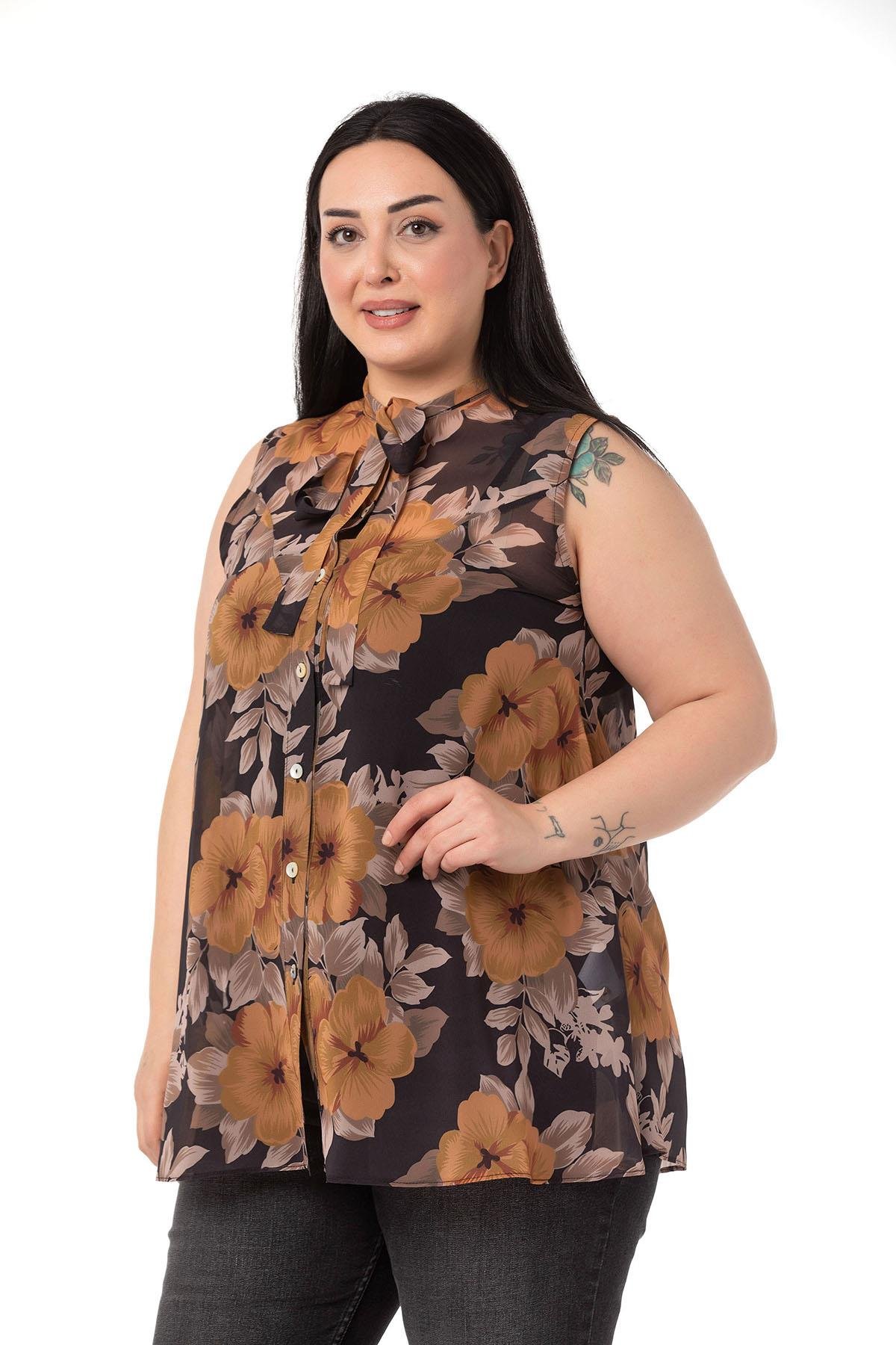 ShirtsDISENTIS GENC BUYUK BEDEN BIGSIZE SIFON GOMLEK KOLSUZ GOMLEKDISENTIS MODESTBüyük Beden Kendinden Fularlı Kolsuz Çiçek Desenli Şifon Hardal Gömlek
