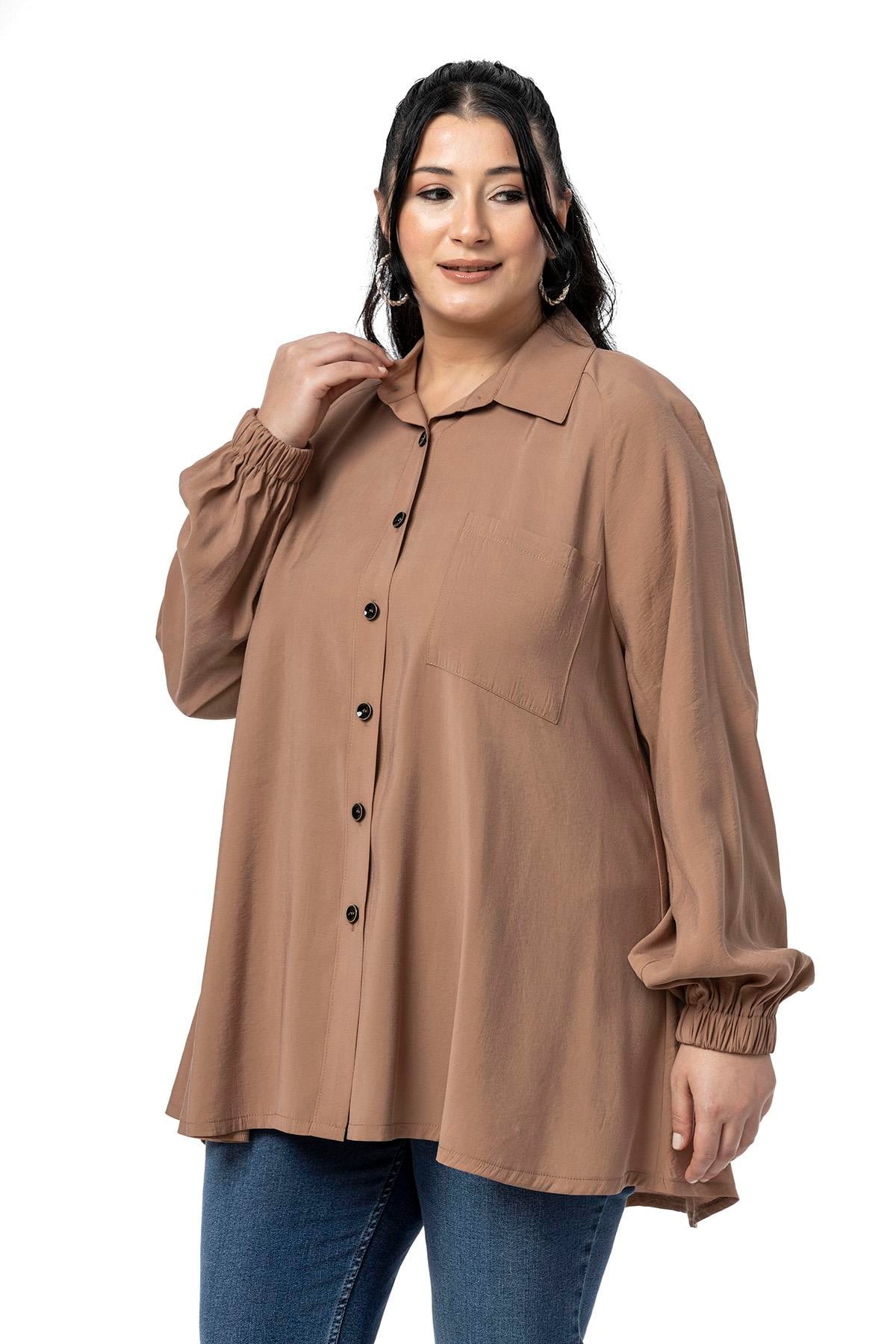 GömlekDisentis Modest Büyük Beden Kol Ağzı Lastikli Geniş Kesim Reglan Kol Vizon GömlekDISENTIS MODESTBüyük Beden Kol Ağzı Lastikli Geniş Kesim Reglan Kol Vizon Gömlek