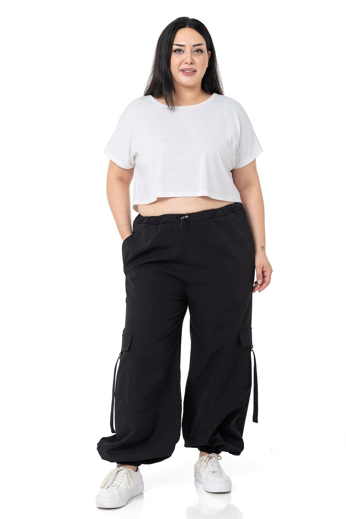 PantolonDISENTIS,BIG SIZE, BÜYÜK BEDEN, PARAŞÜT PANTOLON, KARGO CEPLİ PANTOLON,GENÇ BÜYÜK BEDEN PANTOLONDISENTIS MODESTBüyük Beden Beli ve Paçası Lastikli Kargo Cepli Siyah Paraşüt Pantolon