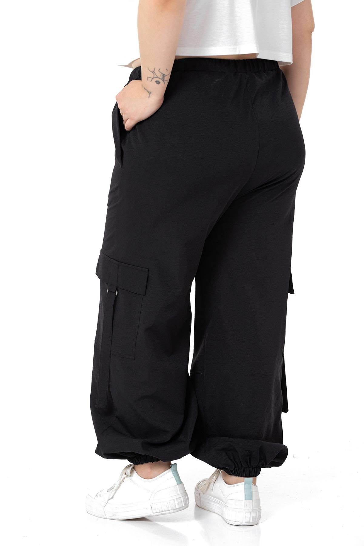 PantolonDISENTIS,BIG SIZE, BÜYÜK BEDEN, PARAŞÜT PANTOLON, KARGO CEPLİ PANTOLON,GENÇ BÜYÜK BEDEN PANTOLONDISENTIS MODESTBüyük Beden Beli ve Paçası Lastikli Kargo Cepli Siyah Paraşüt Pantolon