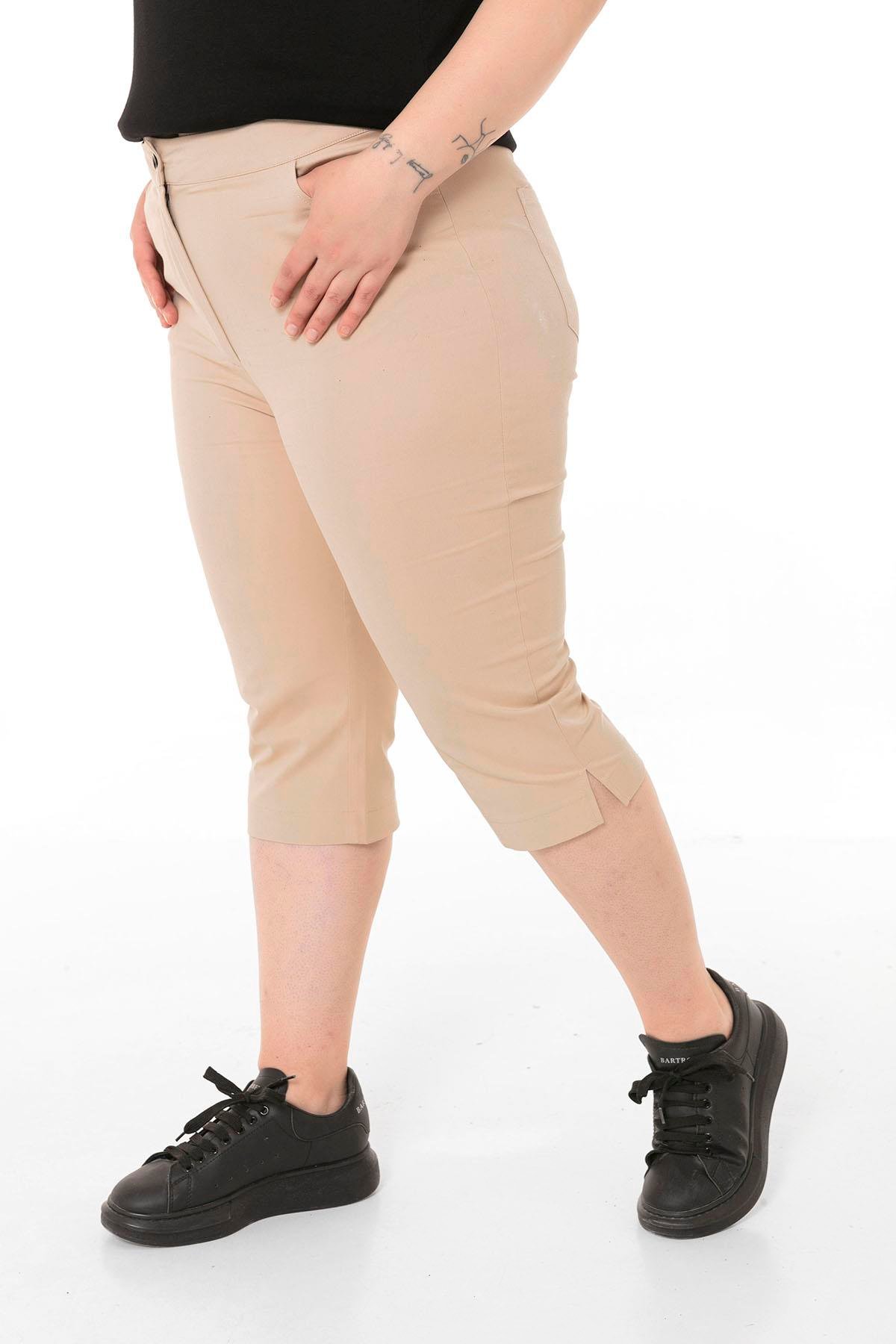 TEK KALANLARDisentis Modest Cepli Model Paçalar Yırtmaçlı Bej Capri PantolonDISENTIS MODESTBüyük Beden Cepli Model Paçalar Yırtmaçlı Bej Capri Pantolon