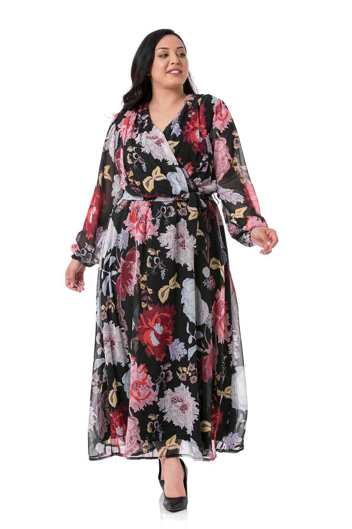 TEK KALANLARBüyük Beden Kruvaze Yaka Astarlı Beli Lastikli ve Kuşaklı Maksi Boy Çiçek Desenli Siyah Şifon ElbiseDISENTIS MODESTBüyük Beden Kruvaze Yaka Astarlı Beli Lastikli ve Kuşaklı Maksi Boy Çiçek Desenli Siyah Şifon Elbise