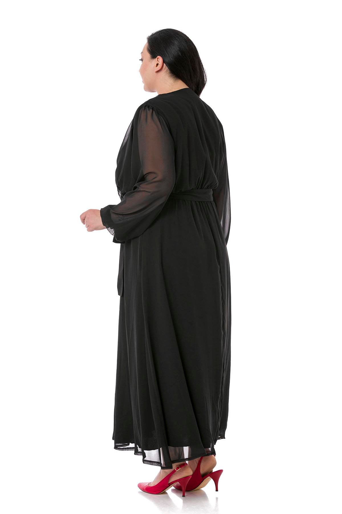 TEK KALANLARBüyük Beden Kruvaze Yaka Beli Kuşaklı Kolları Tül Maksi Boy Astarlı Siyah Şifon ElbiseDISENTIS MODESTBüyük Beden Kruvaze Yaka Beli Kuşaklı Kolları Tül Maksi Boy Astarlı Siyah Şifon Elbise