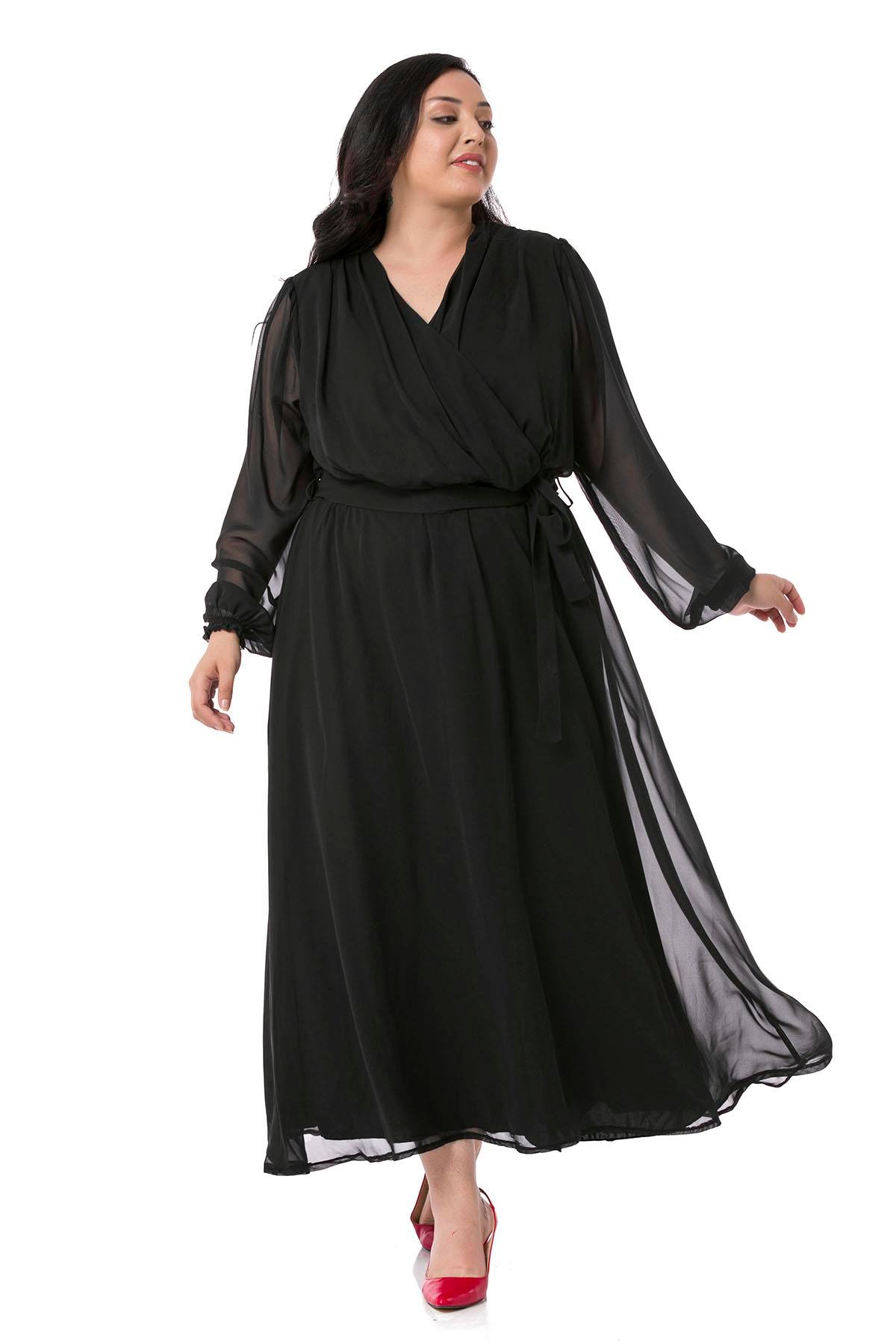 TEK KALANLARBüyük Beden Kruvaze Yaka Beli Kuşaklı Kolları Tül Maksi Boy Astarlı Siyah Şifon ElbiseDISENTIS MODESTBüyük Beden Kruvaze Yaka Beli Kuşaklı Kolları Tül Maksi Boy Astarlı Siyah Şifon Elbise