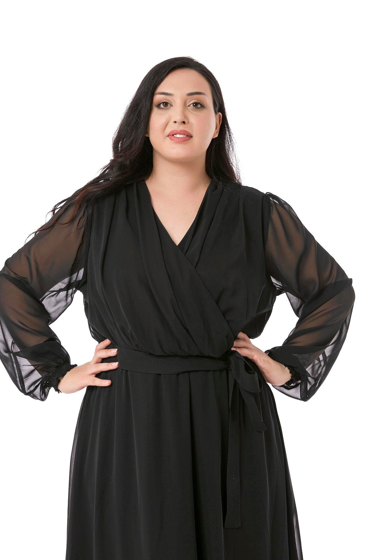 TEK KALANLARBüyük Beden Kruvaze Yaka Beli Kuşaklı Kolları Tül Maksi Boy Astarlı Siyah Şifon ElbiseDISENTIS MODESTBüyük Beden Kruvaze Yaka Beli Kuşaklı Kolları Tül Maksi Boy Astarlı Siyah Şifon Elbise