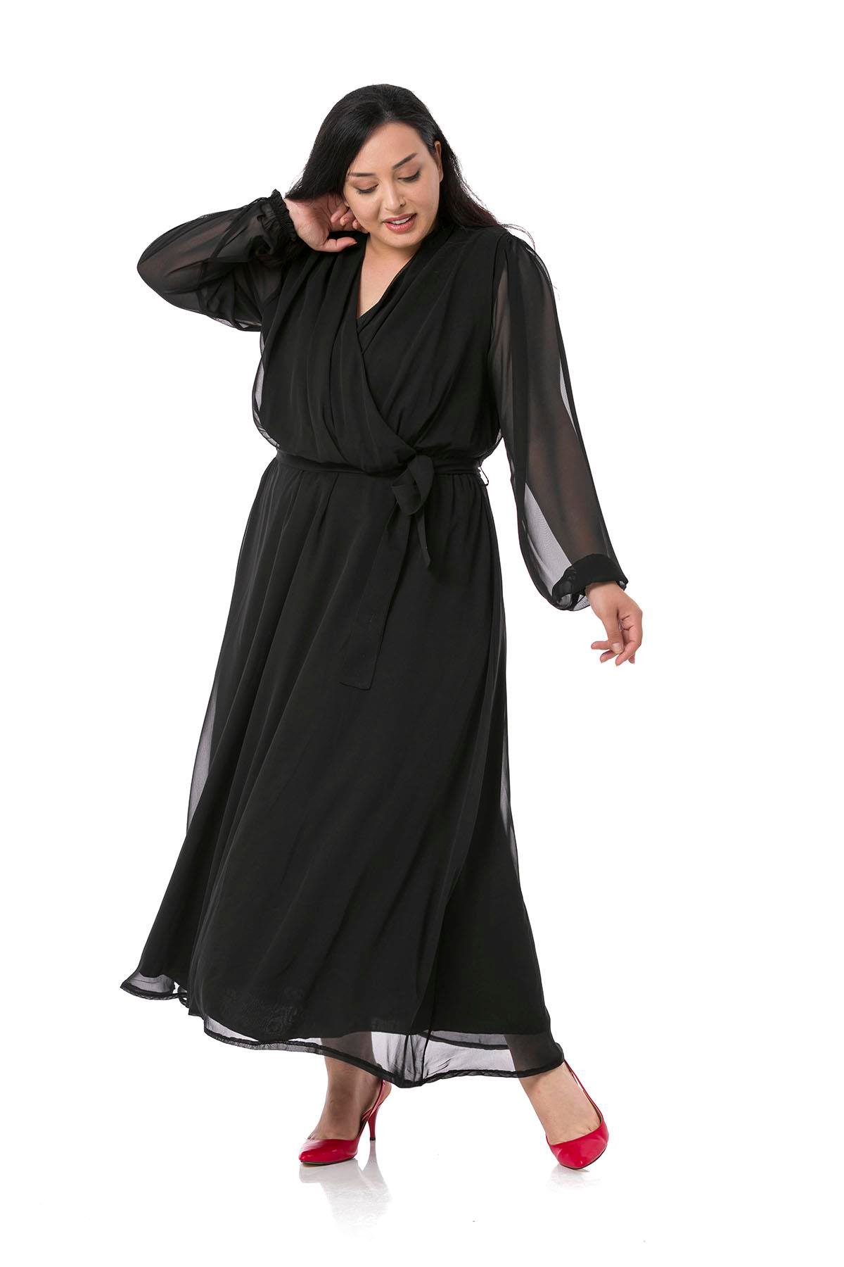 TEK KALANLARBüyük Beden Kruvaze Yaka Beli Kuşaklı Kolları Tül Maksi Boy Astarlı Siyah Şifon ElbiseDISENTIS MODESTBüyük Beden Kruvaze Yaka Beli Kuşaklı Kolları Tül Maksi Boy Astarlı Siyah Şifon Elbise