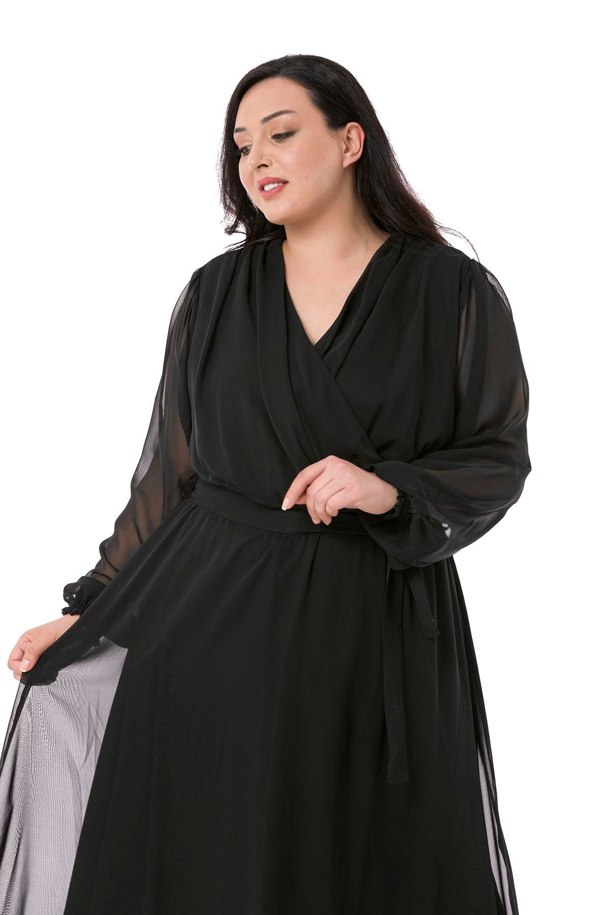 TEK KALANLARBüyük Beden Kruvaze Yaka Beli Kuşaklı Kolları Tül Maksi Boy Astarlı Siyah Şifon ElbiseDISENTIS MODESTBüyük Beden Kruvaze Yaka Beli Kuşaklı Kolları Tül Maksi Boy Astarlı Siyah Şifon Elbise