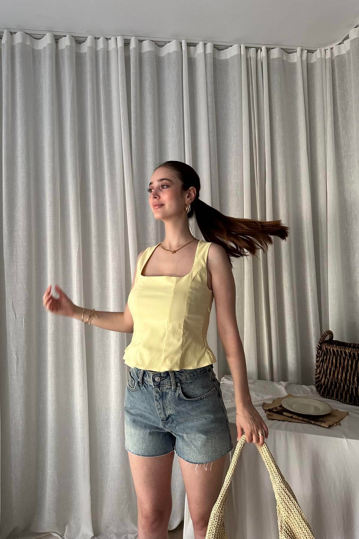 PEPLUM KORSE TOP