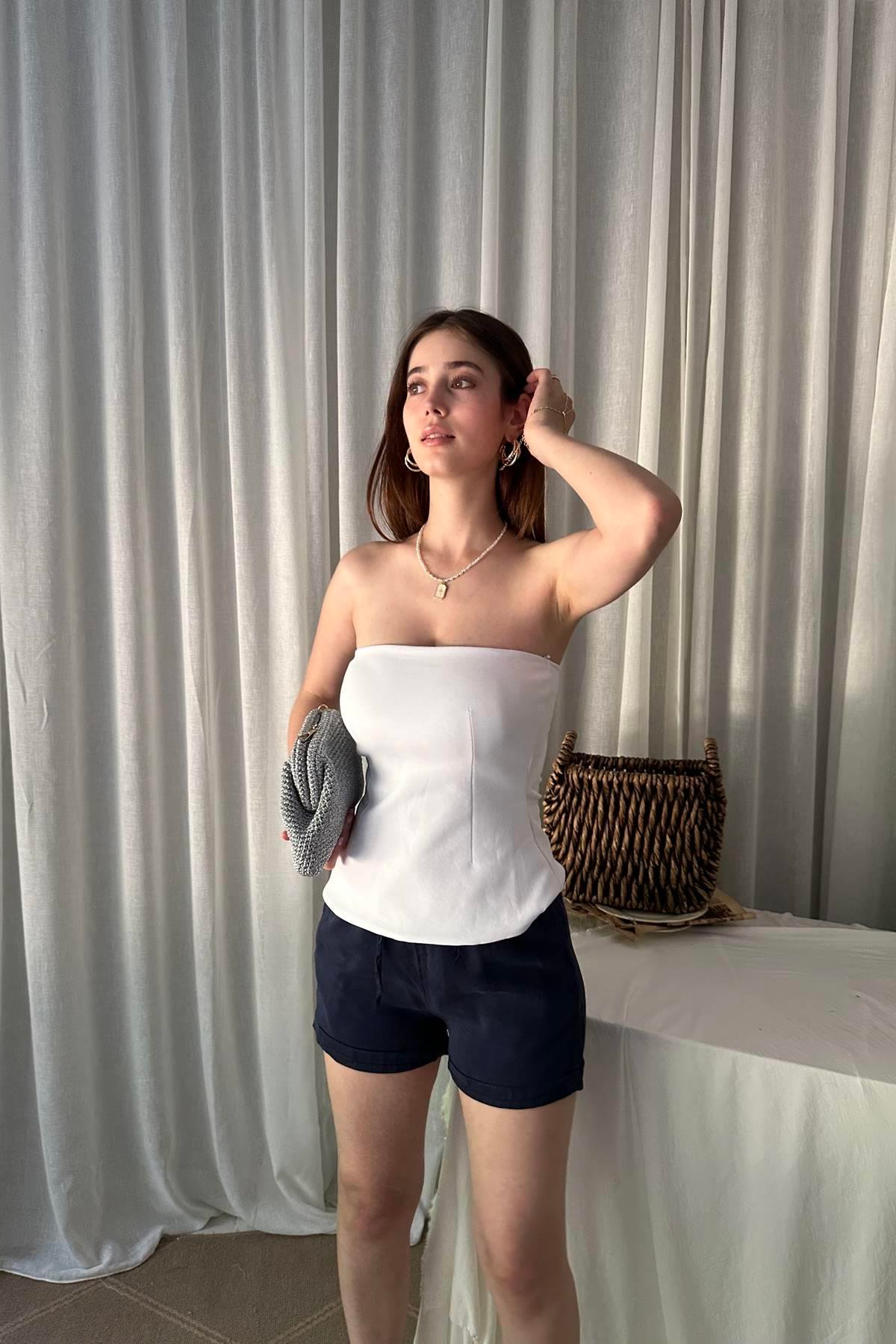 STRAPLEZ PEPLUM TOP