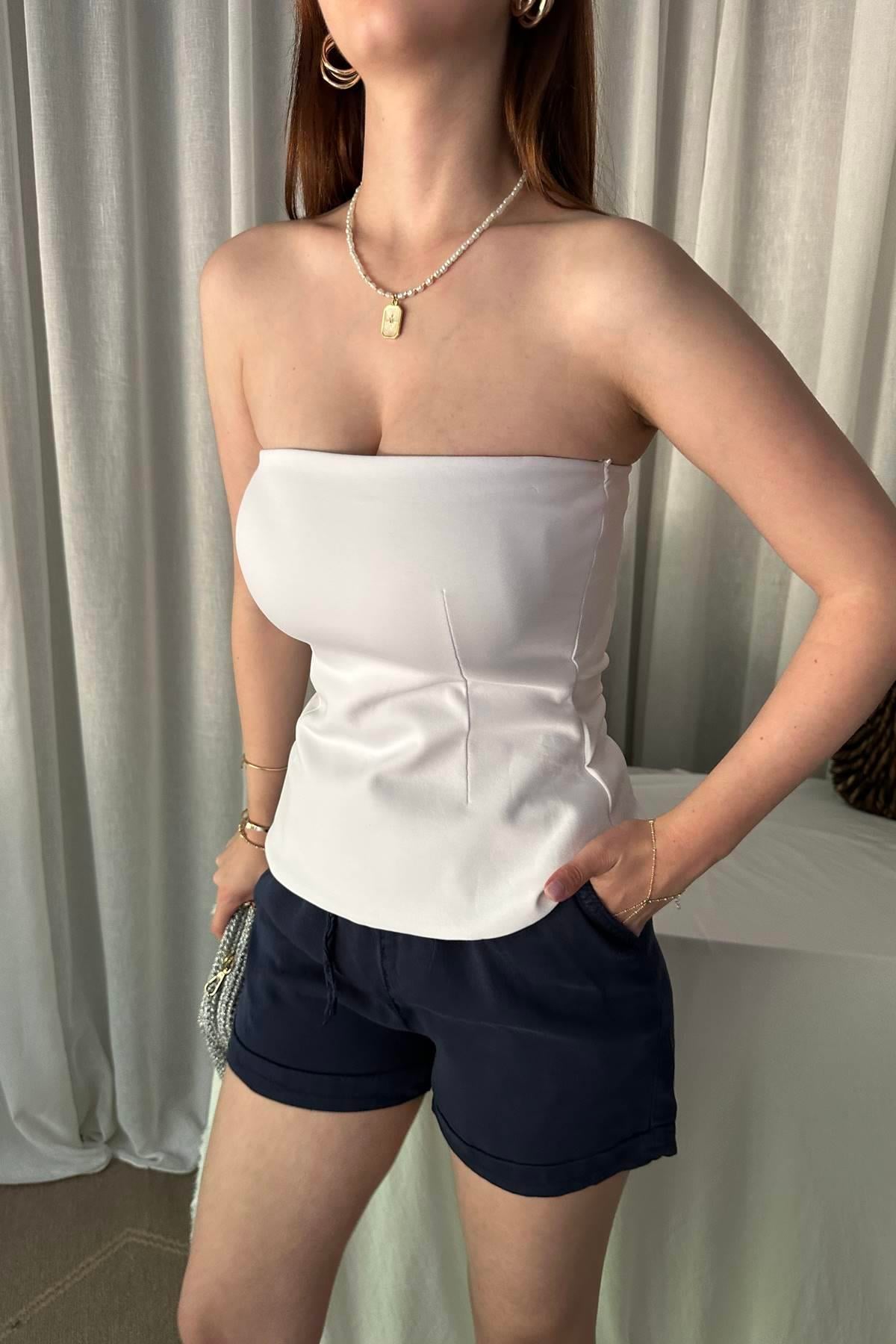 STRAPLEZ PEPLUM TOP