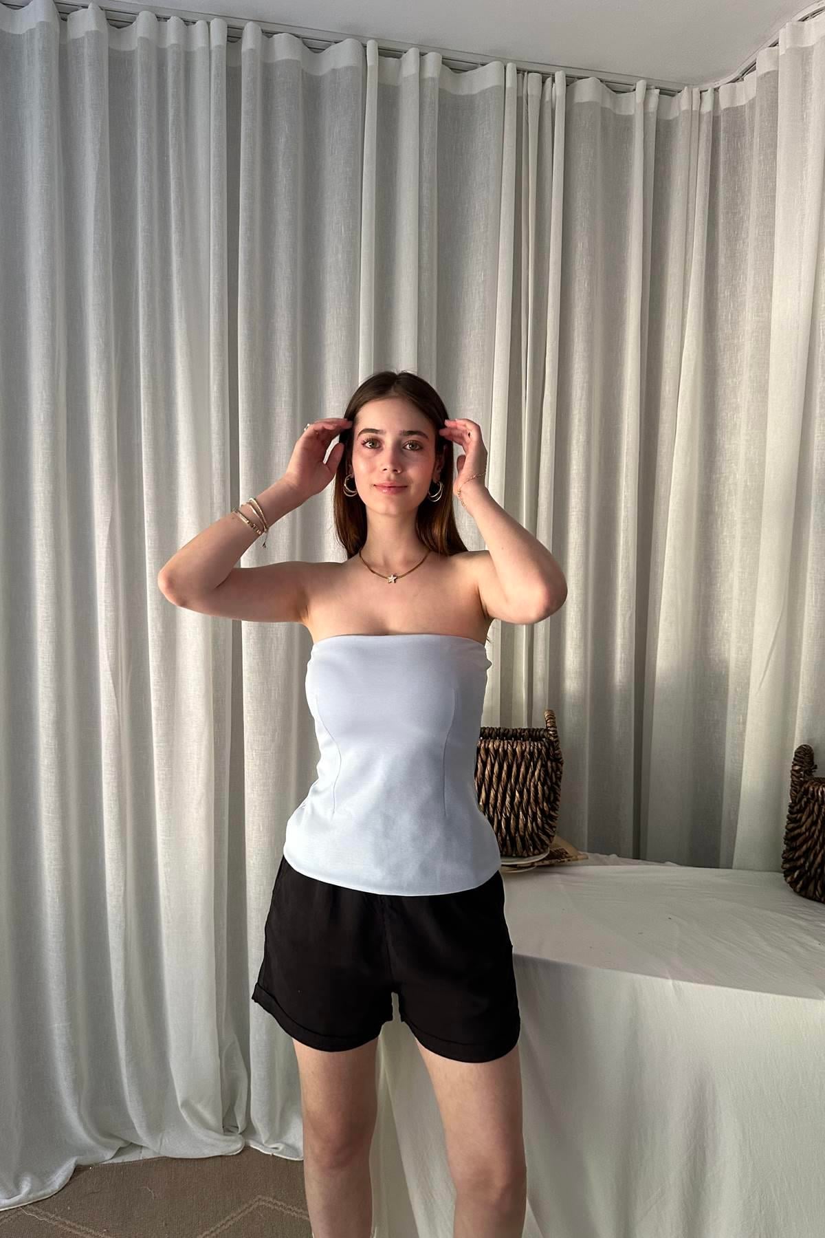STRAPLEZ PEPLUM TOP