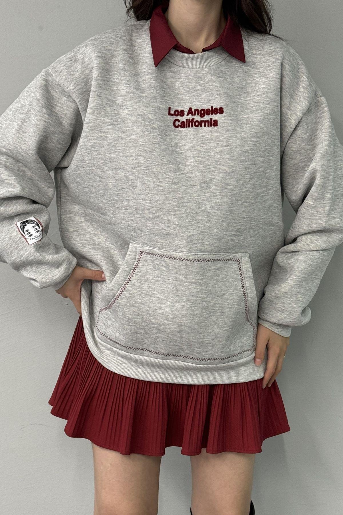 BASKI DETAYLI CEPLİ SWEATSHIRT