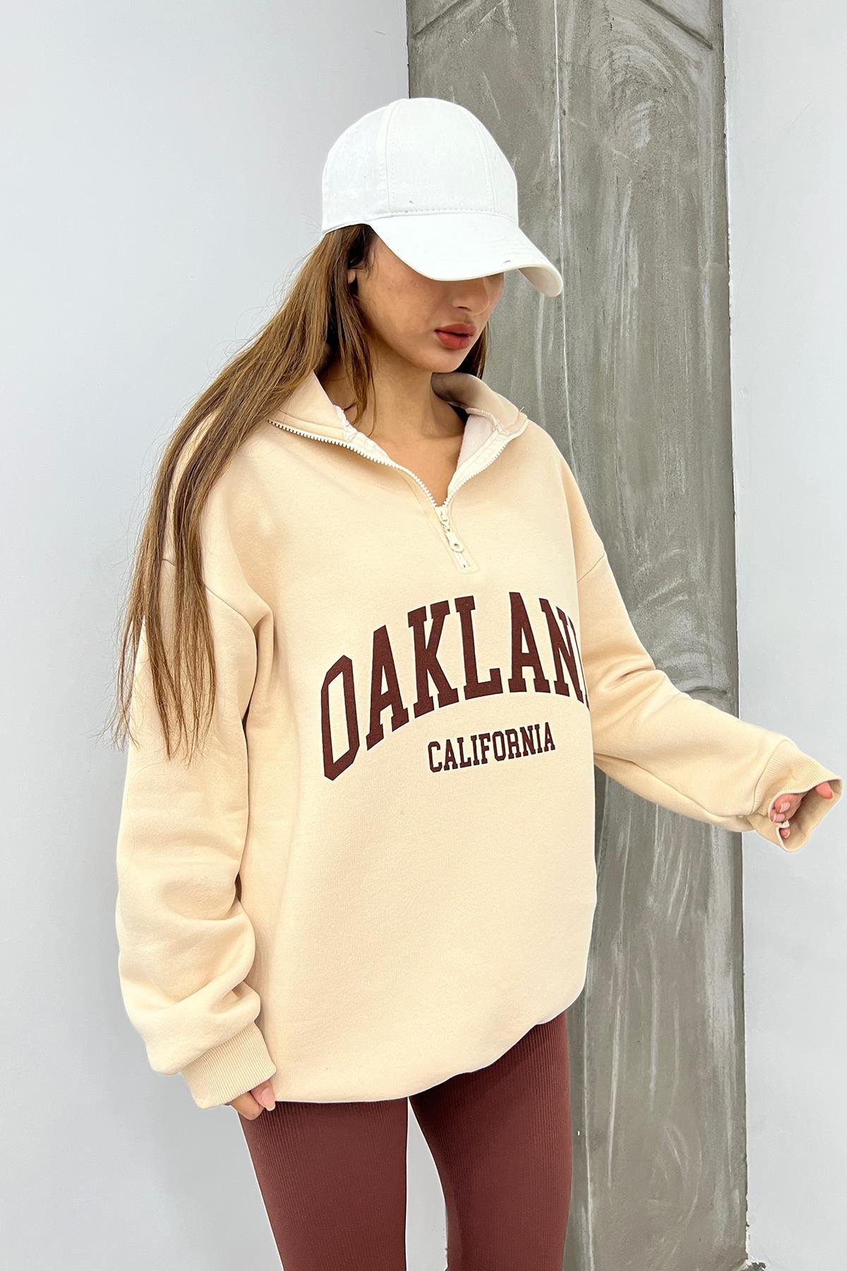 Krem Oakland Baskılı Fermuarlı SweatSun VictoriaKrem Oakland Baskılı Fermuarlı Sweat