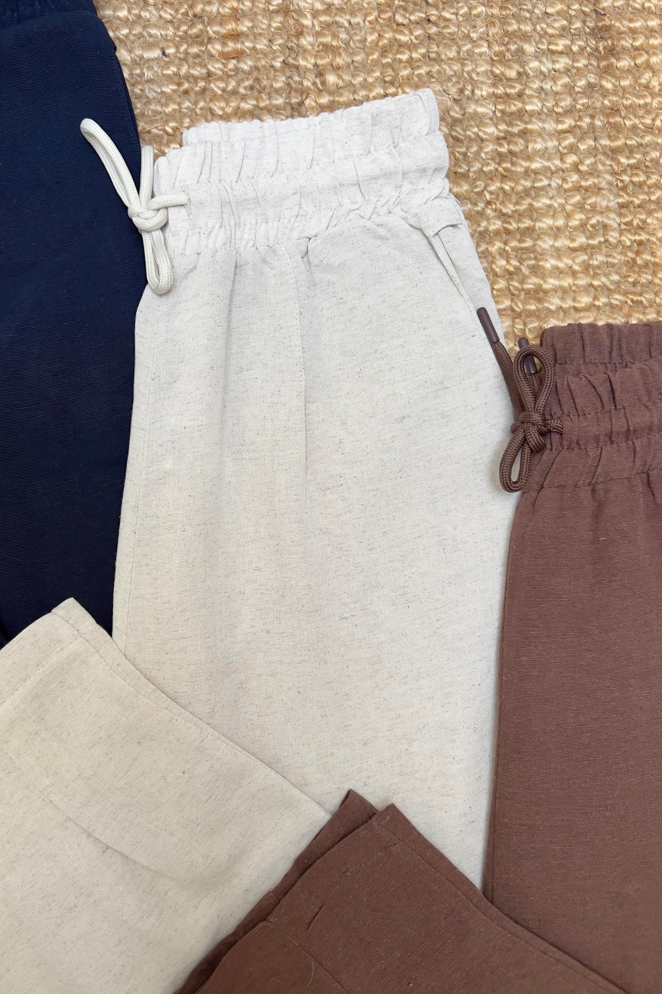 Taş Beli Lastikli Paçası Pileli Keten Pantolon uygun fiyatlarda www.butikhola.com adresinde