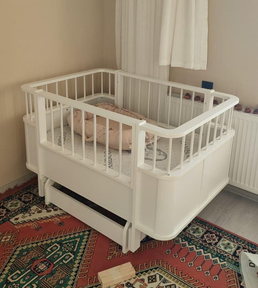 BÜYÜYEN BEŞİK SALLAMA APARATI