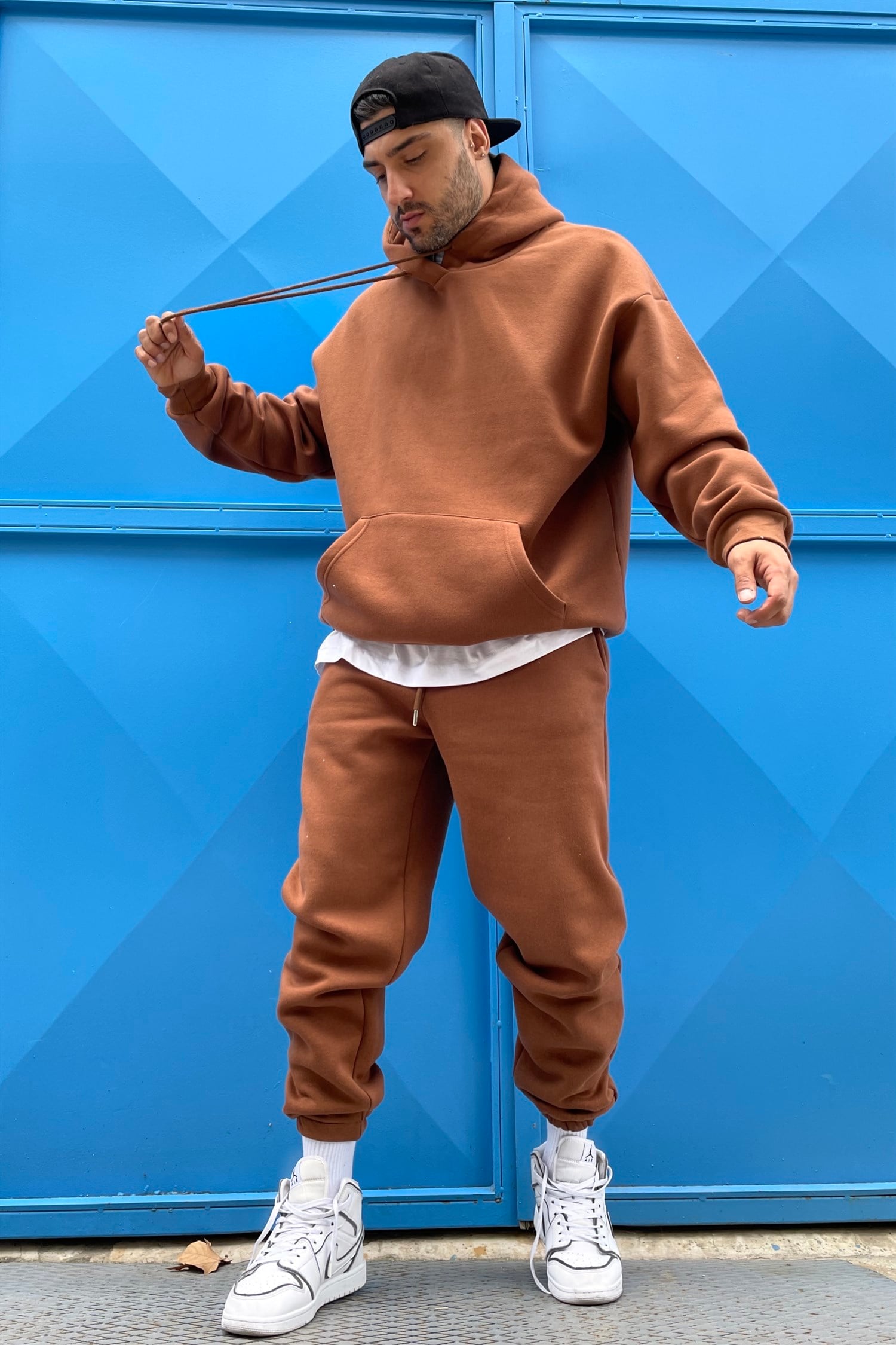 brown track suit