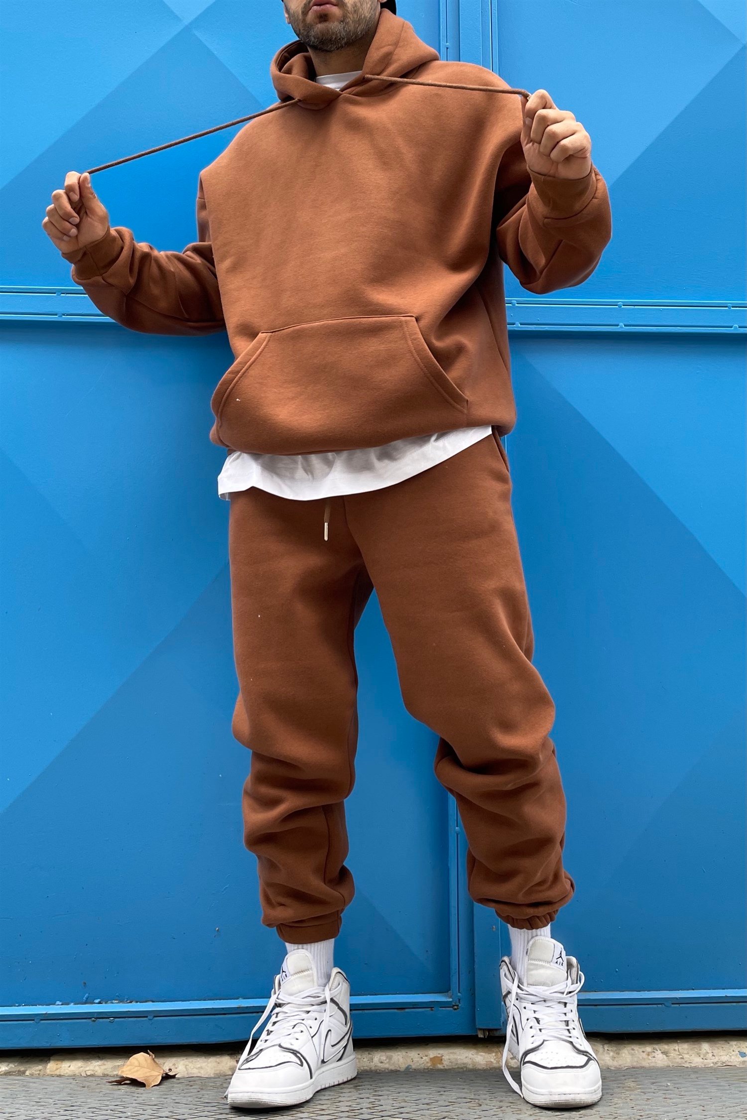 brown track suit