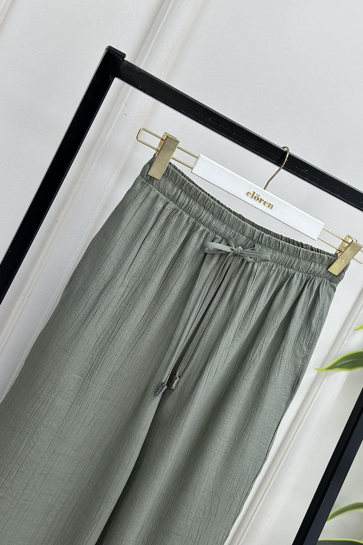 Tesettür PantolonÇilek Kumaş Beli Lastikli Bol Paça Kadın Pantolon Açık Yeşil MLH 6001