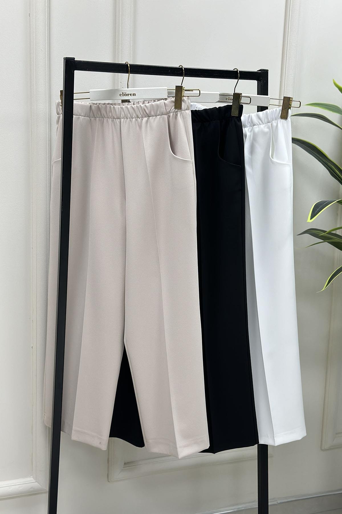 Tesettür PantolonEsmira Beli Lastikli Bol Paça Cepli Kadın Pantolon Beyaz ESM 1301