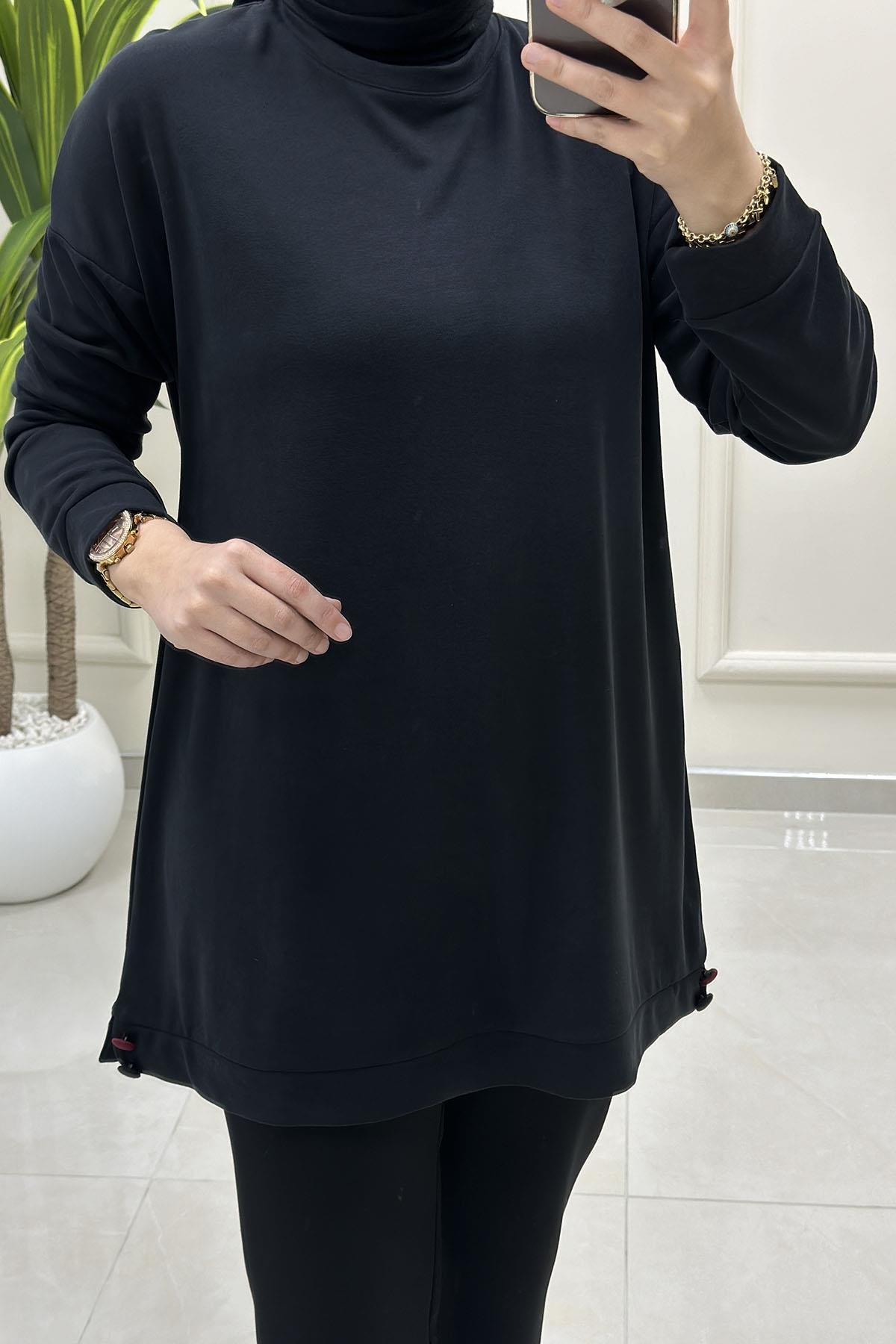 Tesettür Tunik ModelleriDüşük Omuz Etek Ucu Düğme Detaylı Modal Pike Kadın Tunik Siyah KADO 257498