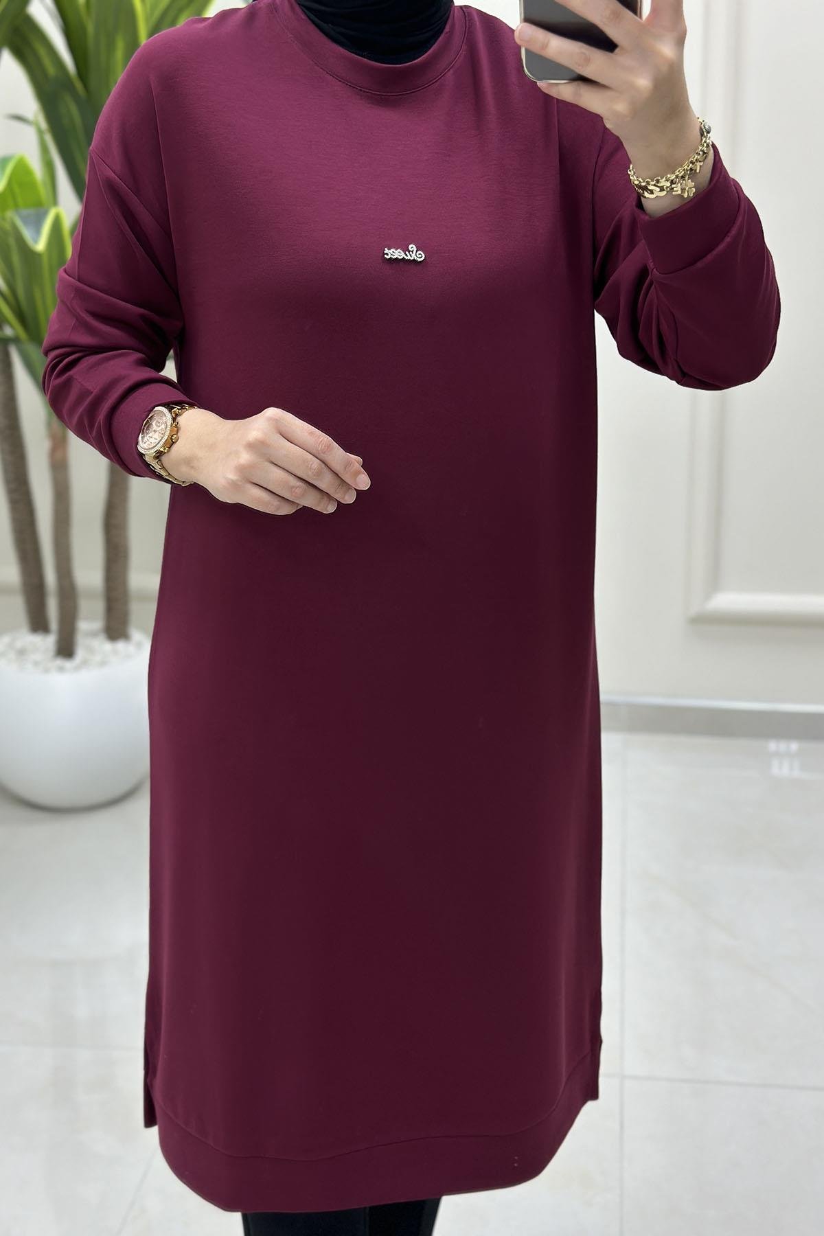 Tesettür Tunik ModelleriDüşük Omuz Önü Aksesuar Detaylı Uzun Kadın Tunik Bordo KADO 257420
