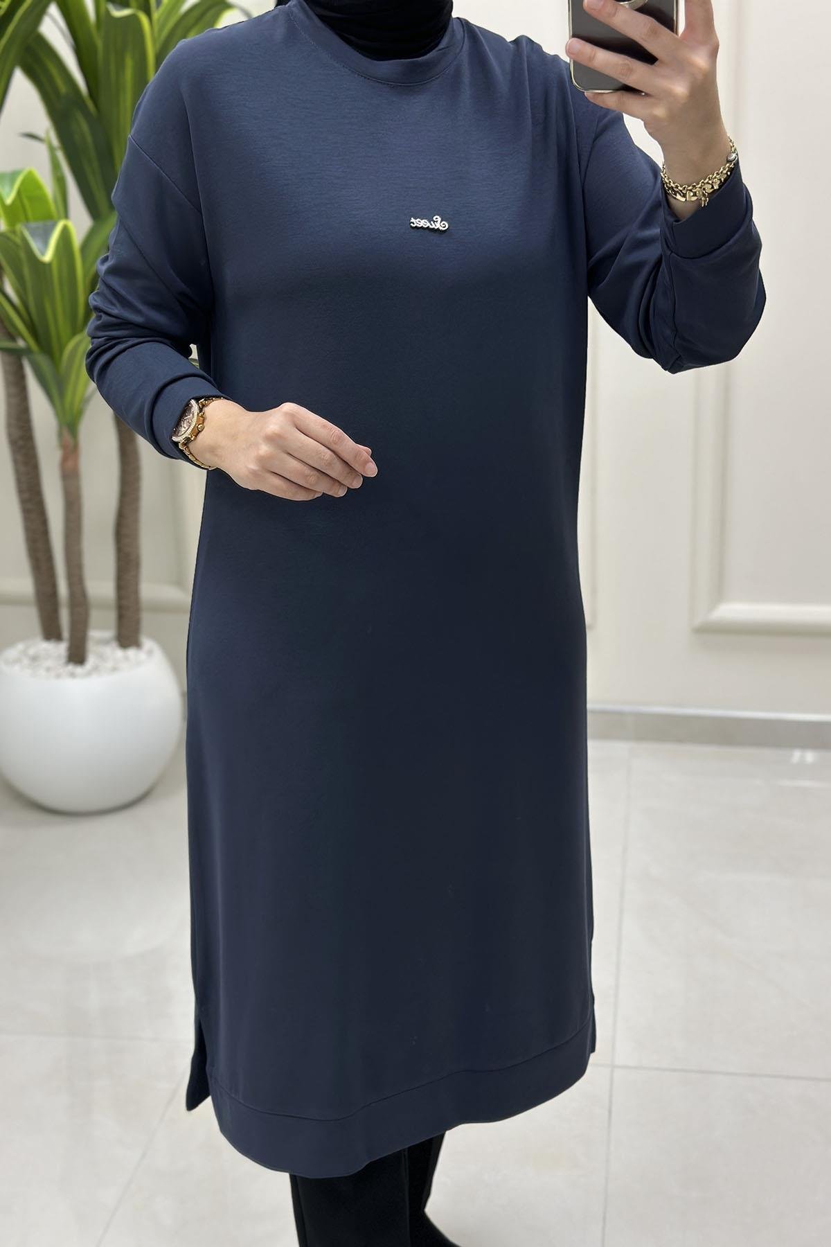 Tesettür Tunik ModelleriDüşük Omuz Önü Aksesuar Detaylı Uzun Kadın Tunik Antrasit KADO 257420