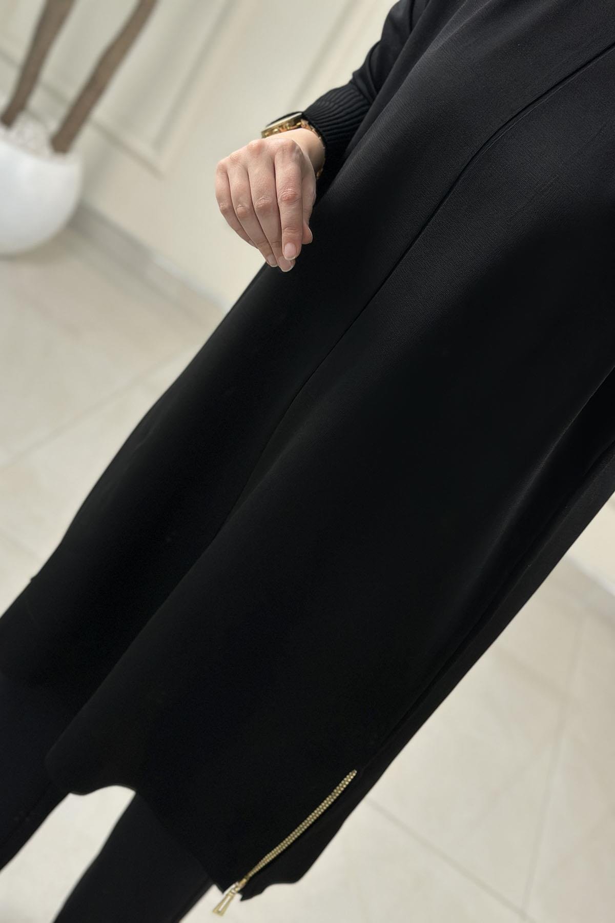 Tesettür Tunik ModelleriDüşük Omuz Yan Fermuar Detaylı Kadın Triko Tunik Siyah KADO 2725013