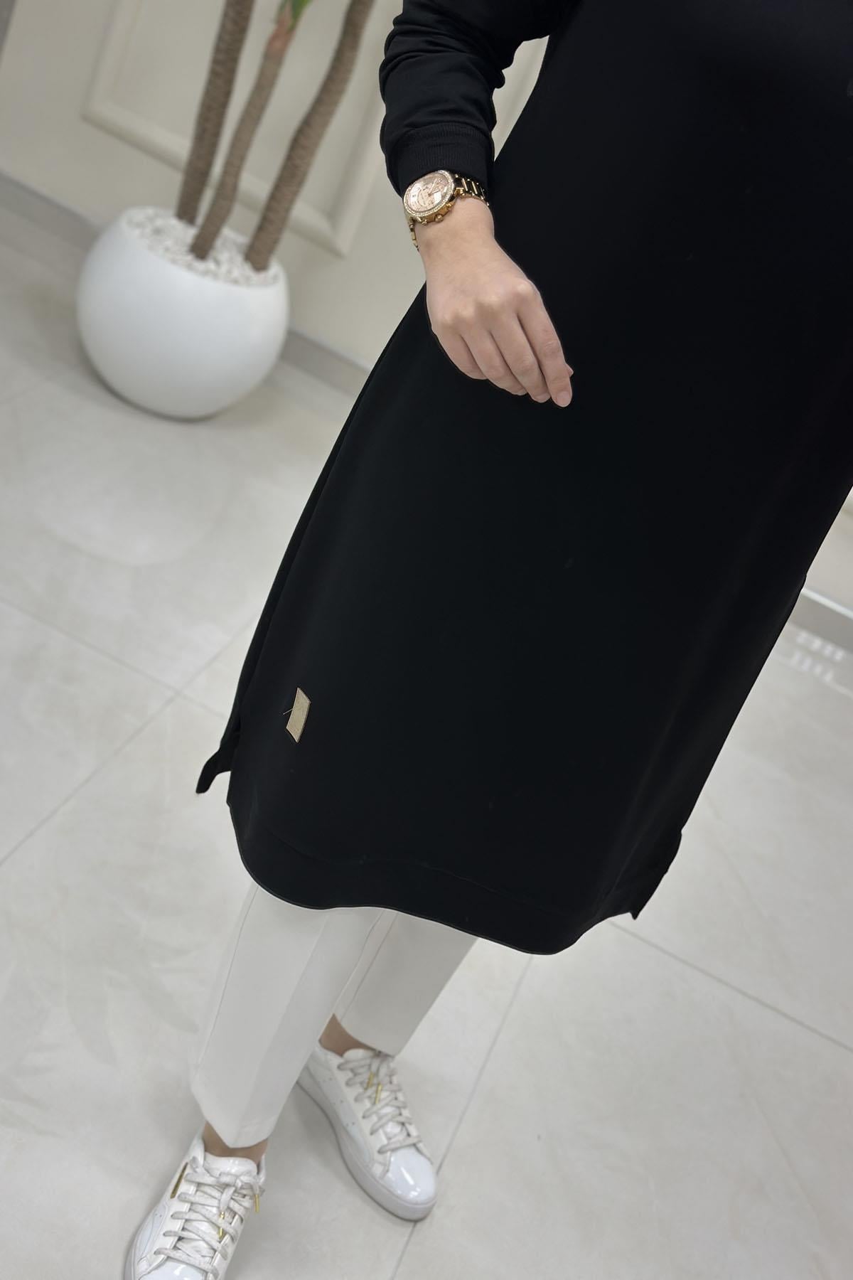 Tesettür Tunik Modelleriİnce Oysho Kol Ve Etek Ucu Ribanalı Spor Kadın Tunik Siyah KADO 7194