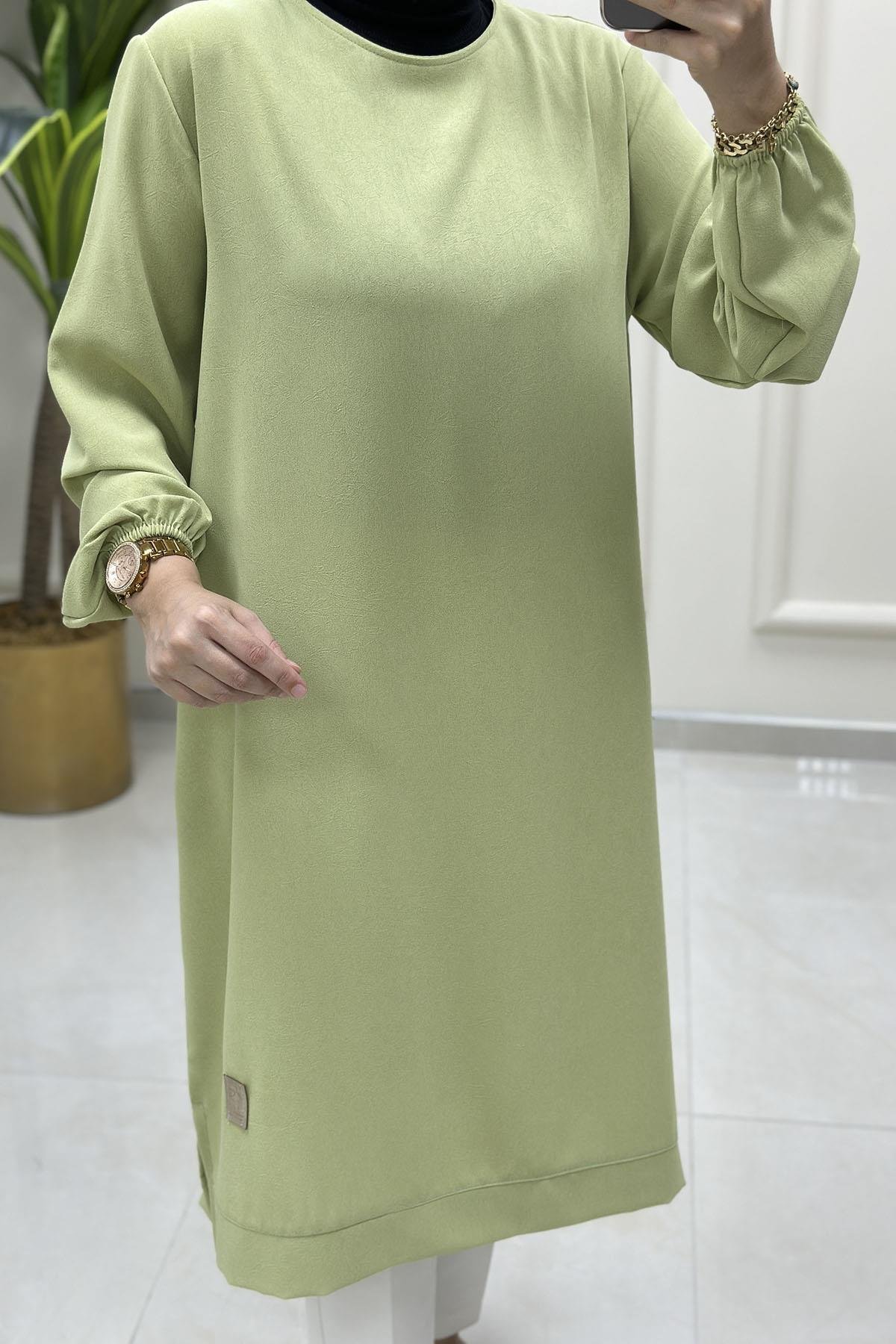 Tesettür Tunik ModelleriKolu Büzgülü Arma Detaylı Uzun Kadın Tunik Açık Yeşil KADO 251765