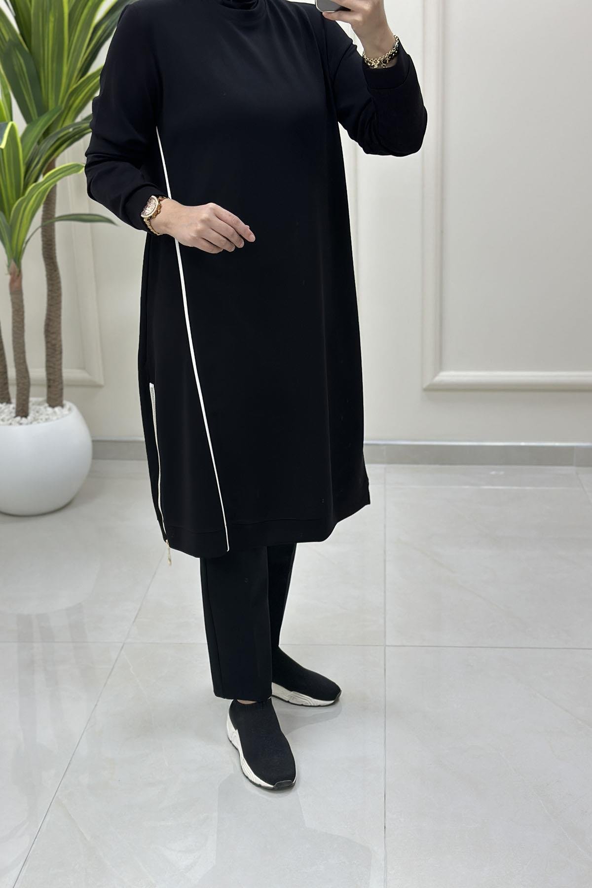 Tesettür Tunik ModelleriÖnü Şeritli Yan Fermuar Detaylı Kadın Tunik Siyah KADO 257536