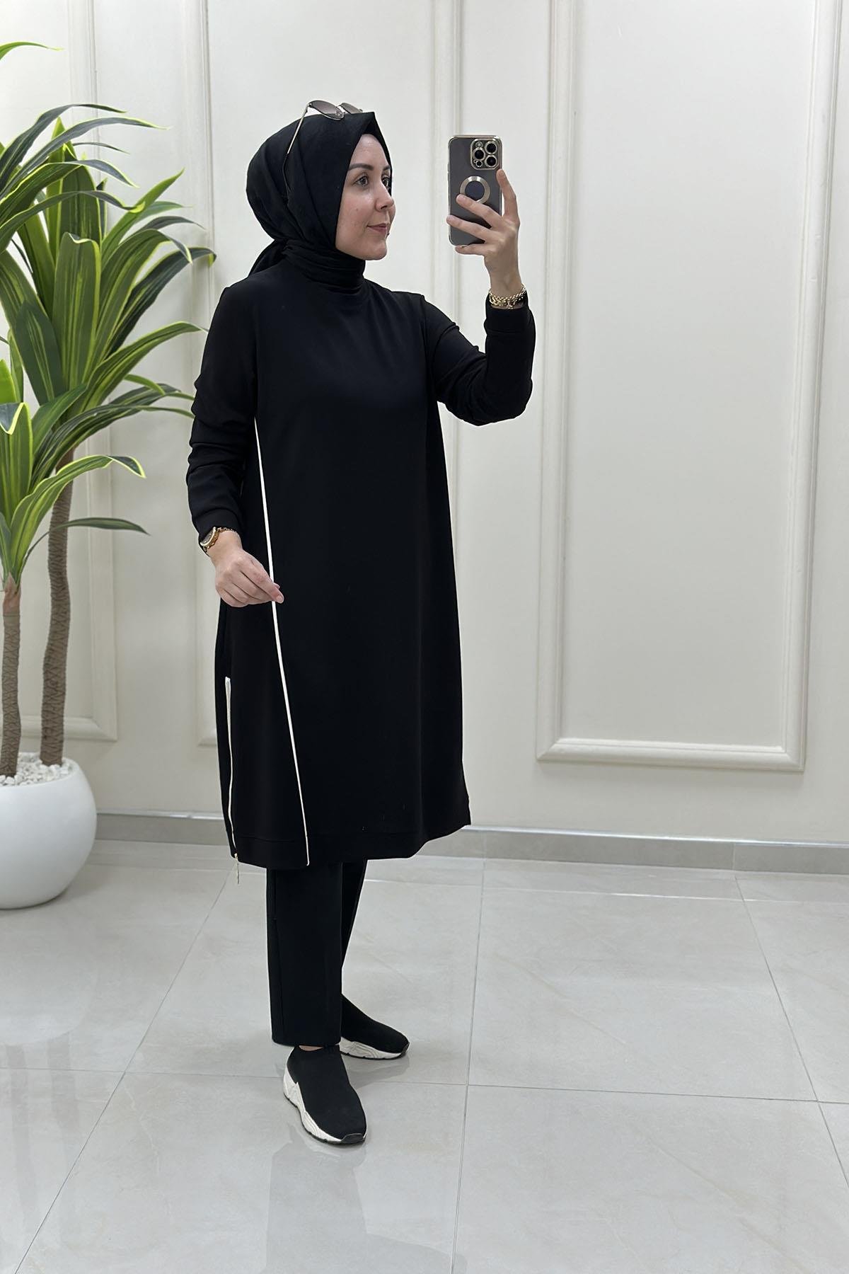 Tesettür Tunik ModelleriÖnü Şeritli Yan Fermuar Detaylı Kadın Tunik Siyah KADO 257536