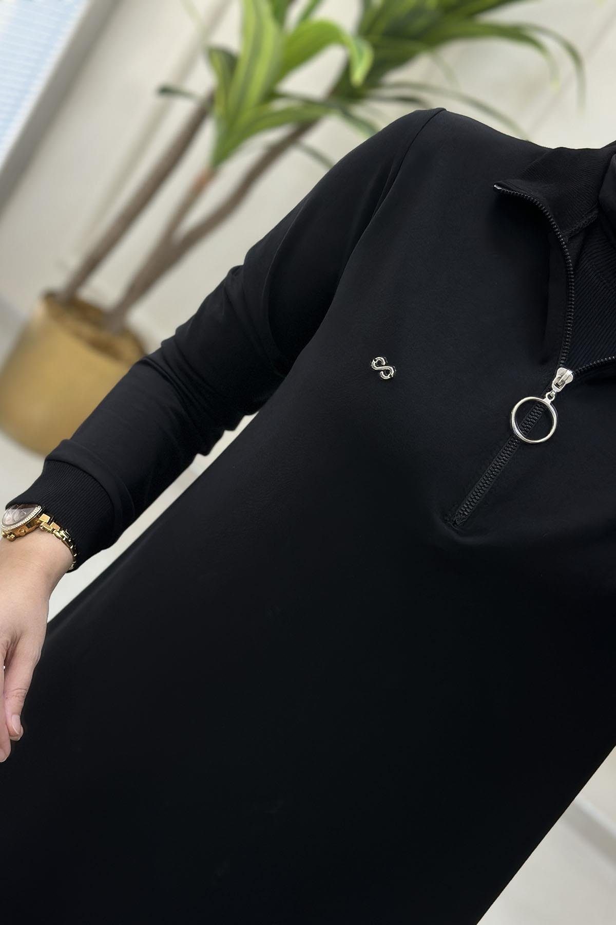 Tesettür Tunik ModelleriÖnü Yarım Fermuarlı Ribana Detaylı Kadın Tunik Siyah KADO 257322