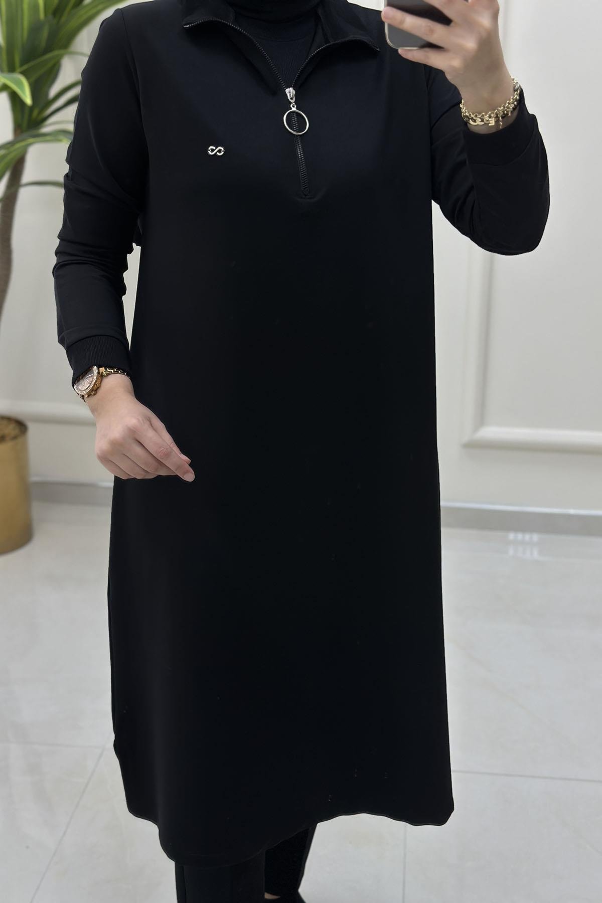 Tesettür Tunik ModelleriÖnü Yarım Fermuarlı Ribana Detaylı Kadın Tunik Siyah KADO 257322